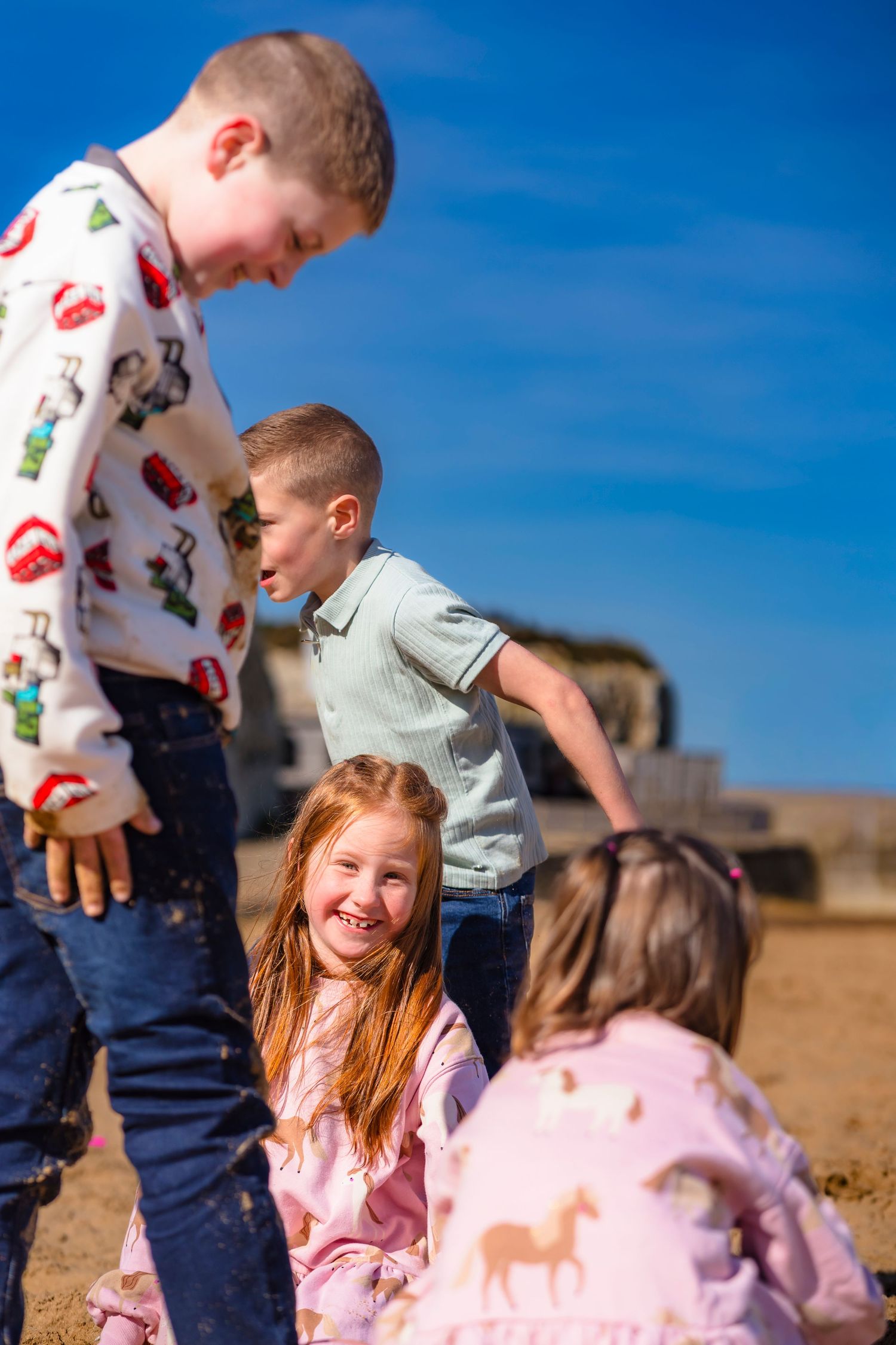 Candid moments of 4 children on sandy Palm Bay Beaches with shorely a memory photography. Laughter, movement and moments.