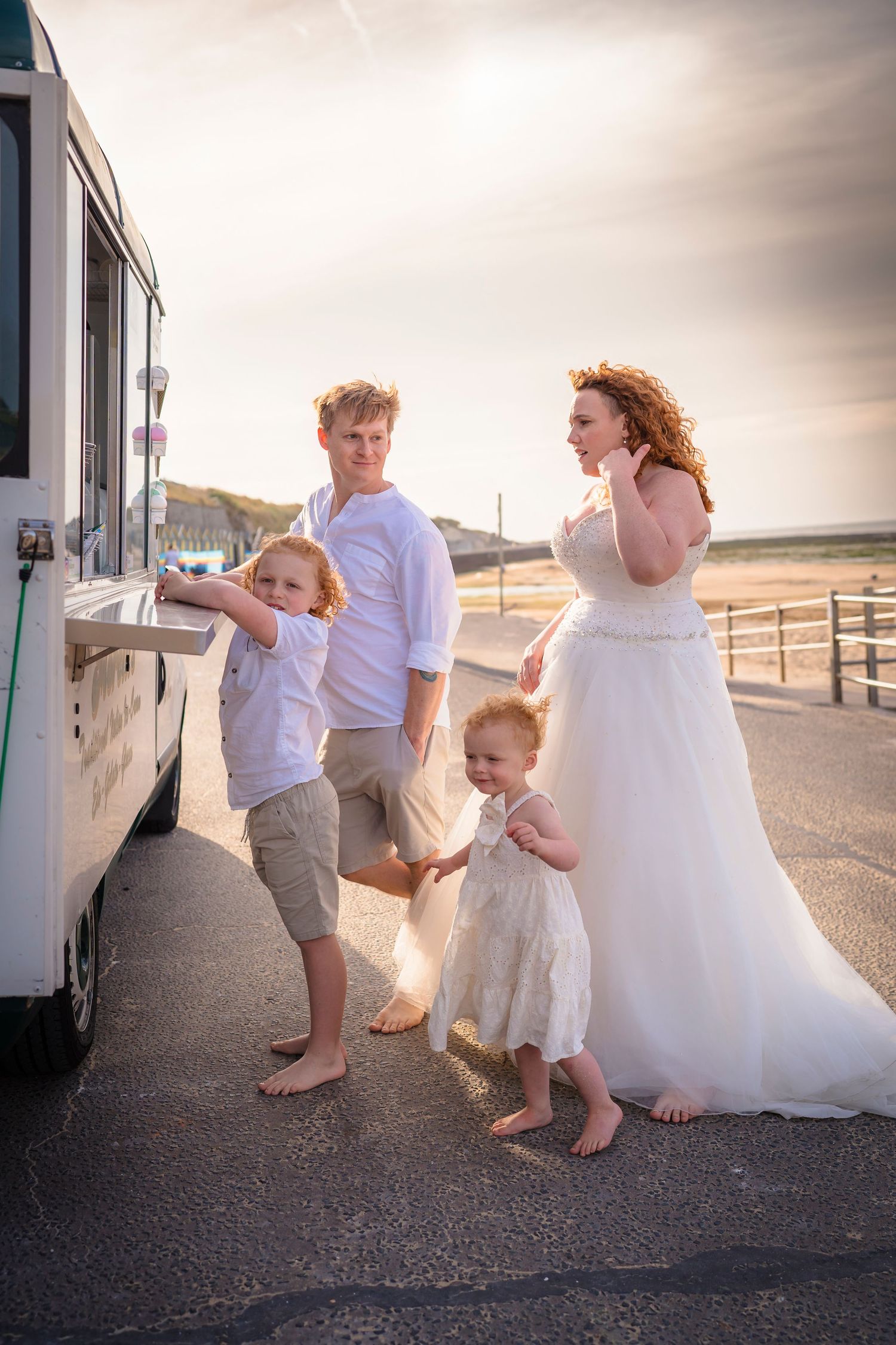A Family dressed in Wedding clothes getting an ice cream on Westbrook Beach for a wreck the dress family photo session with shorely a memory