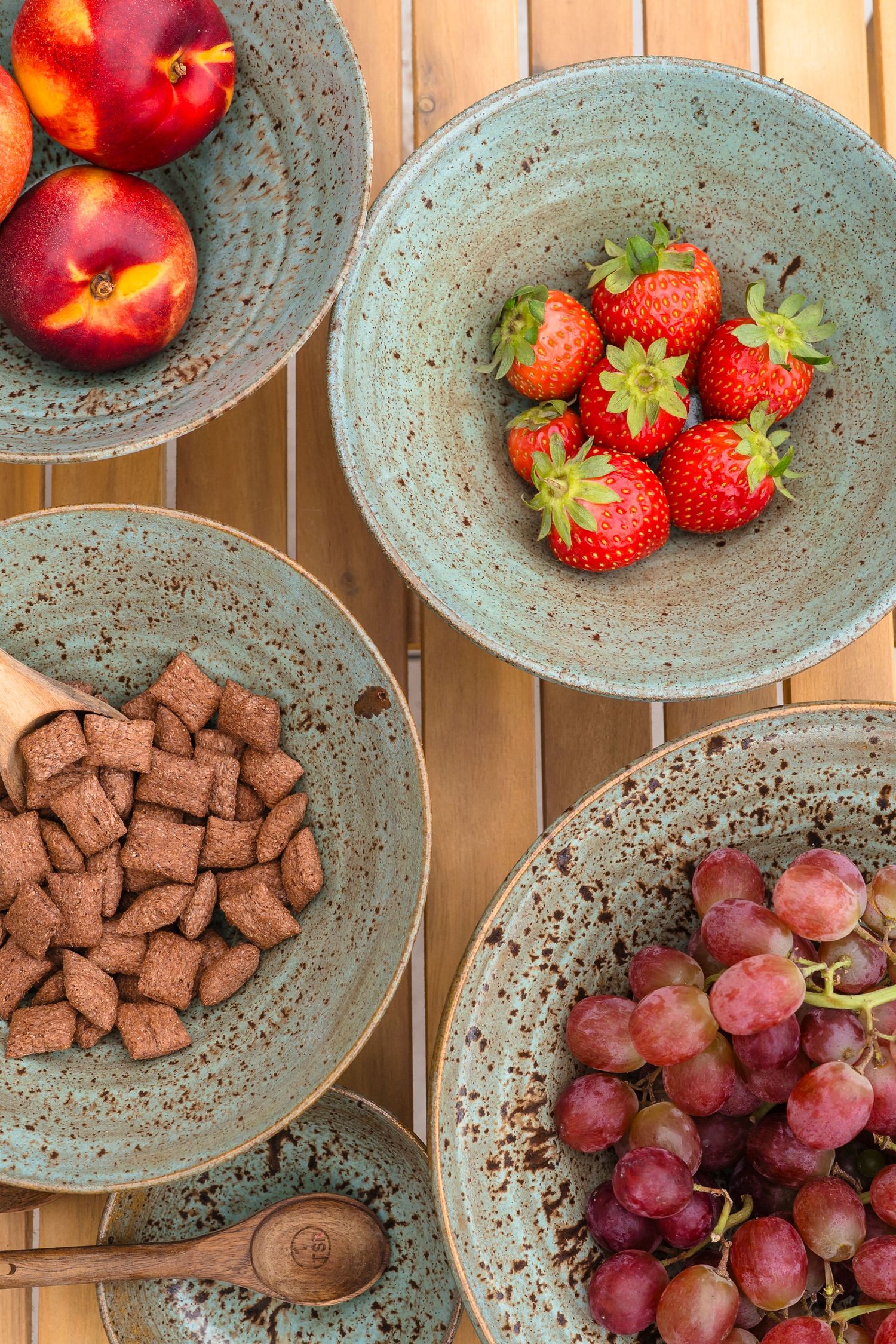 Beautiful hand made speckle bowls filled with lovely fresh fruit and cereals to show how they would look on your table. lifestyle session