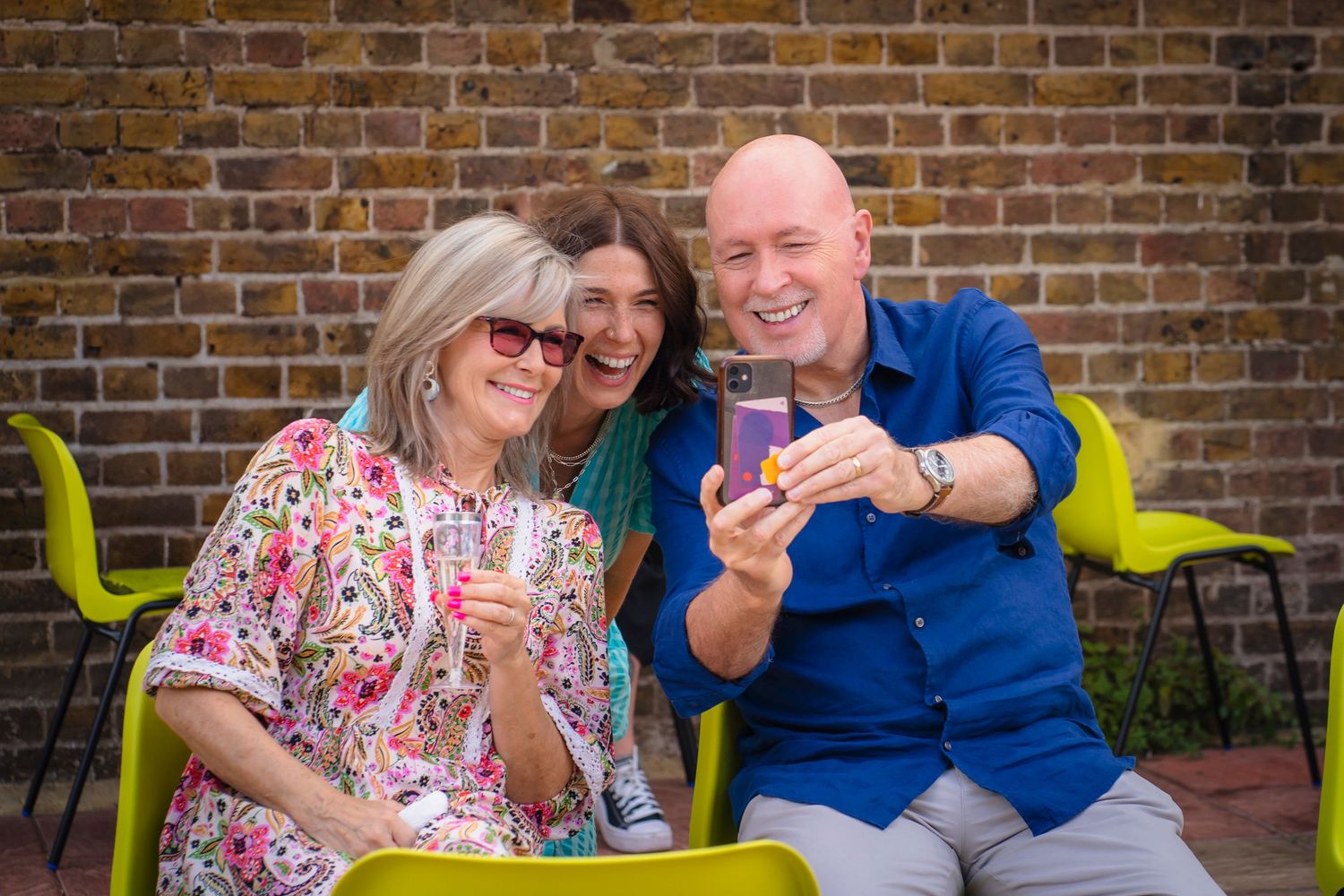 Three guests taking a smiley selfie at a family gathering, candid and unposed photography from shorely a memory photography in Margate