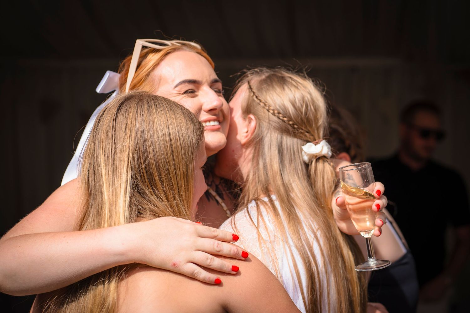 Family hugs at a celebration gathering, candid and unposed, real emotions from shorely a memory photography.