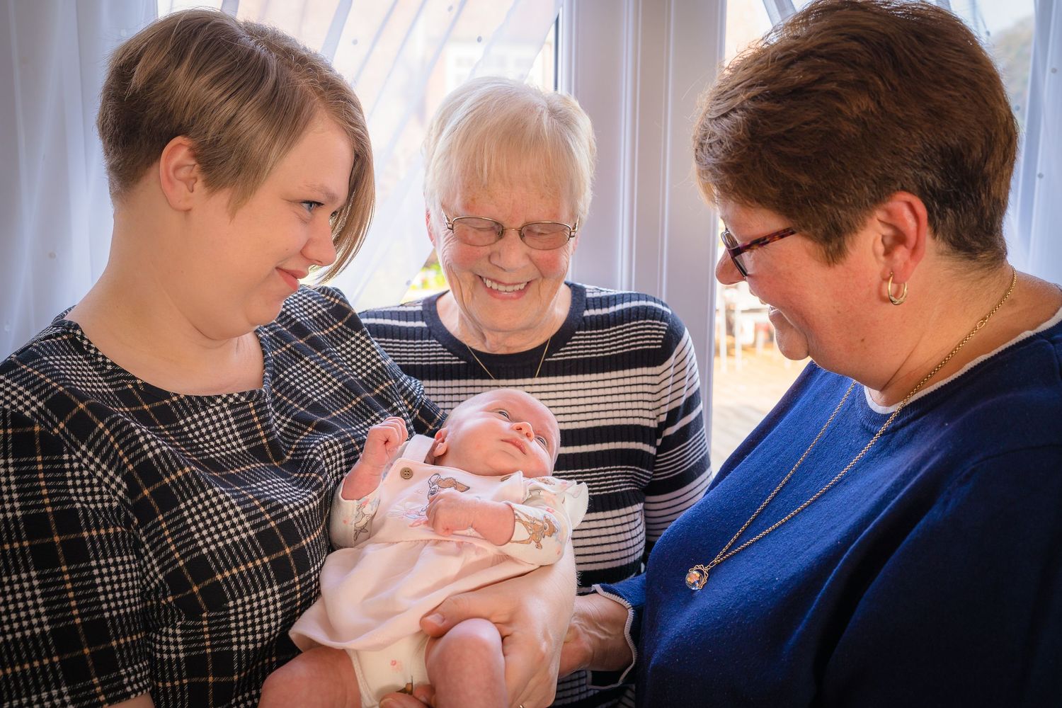 Beautiful generational photograph with 4 generations of ladies at an in home family photo session with Shorely a memory, Kent.