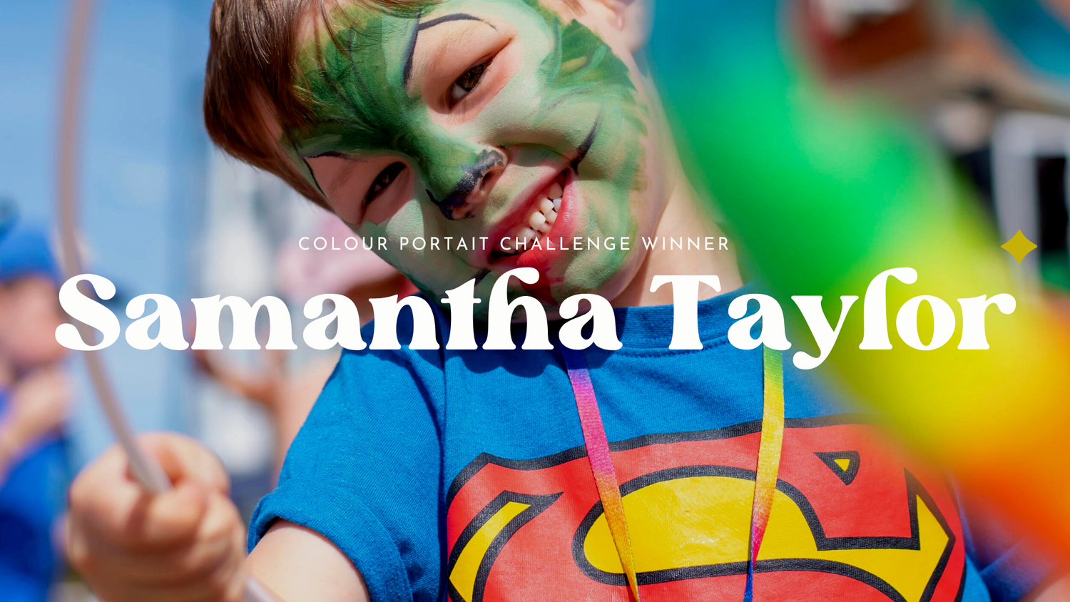 Award for Colourful Portrait competition with a boy with faceprinting and bright clothes at a carnival.