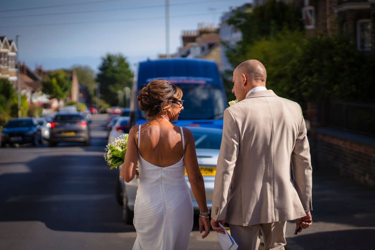 Documentary style walk away shot from a vow renewal in Ramsgate