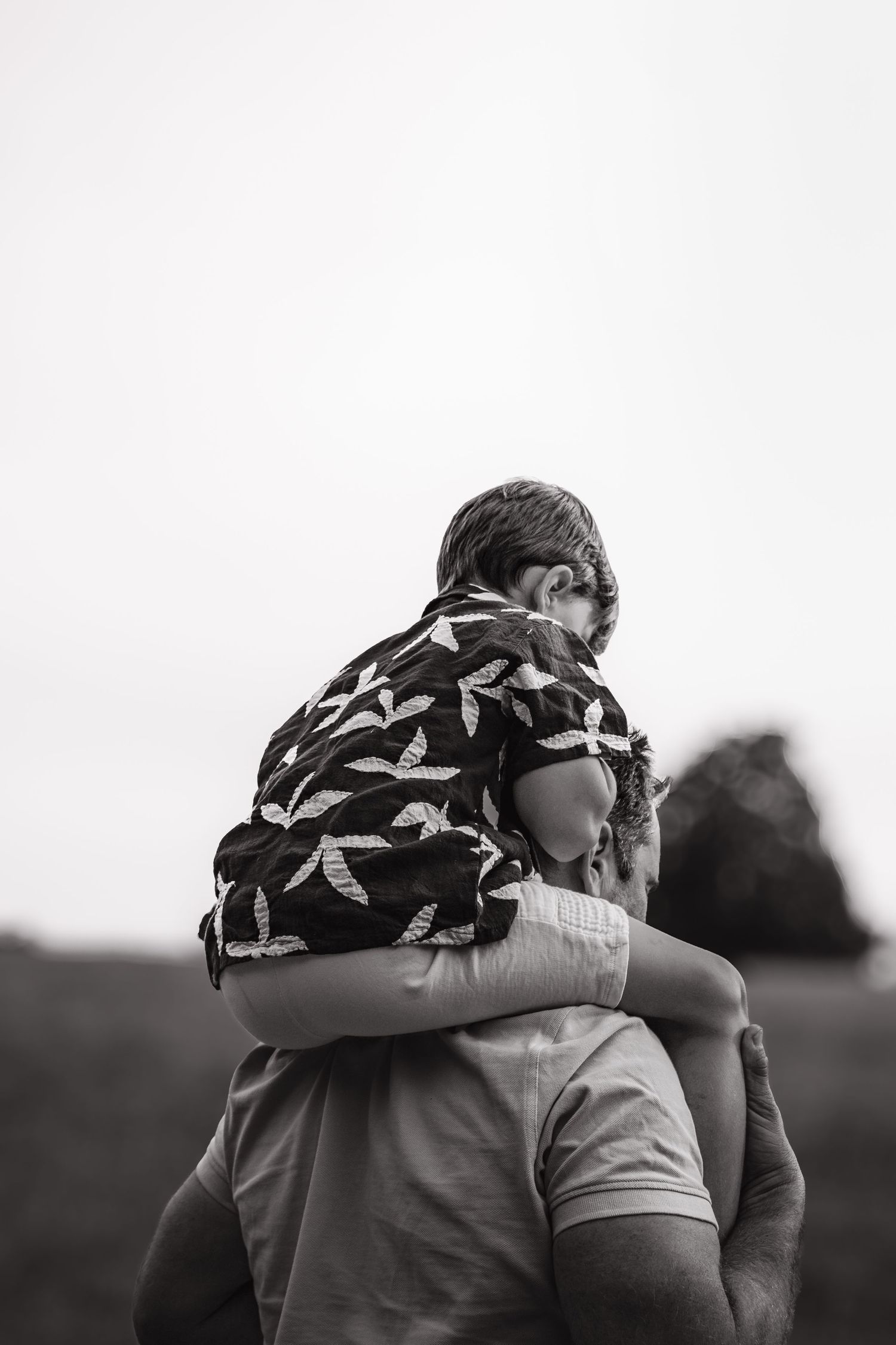Family photography session in Surrey countryside – joyful candid family moment captured at sunset