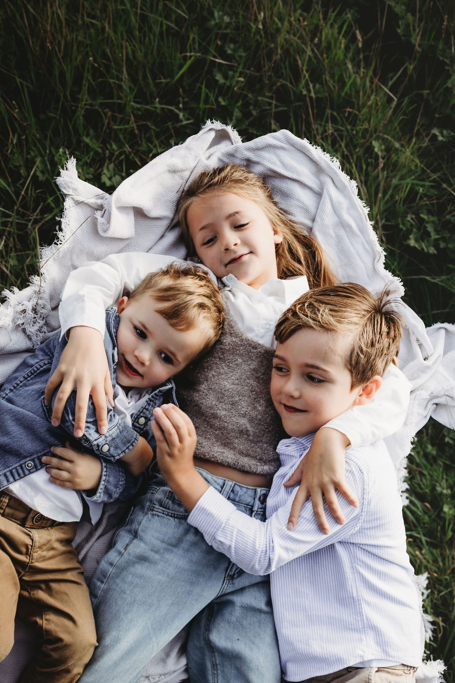Family photography session in Surrey countryside – joyful candid family moment captured at sunset