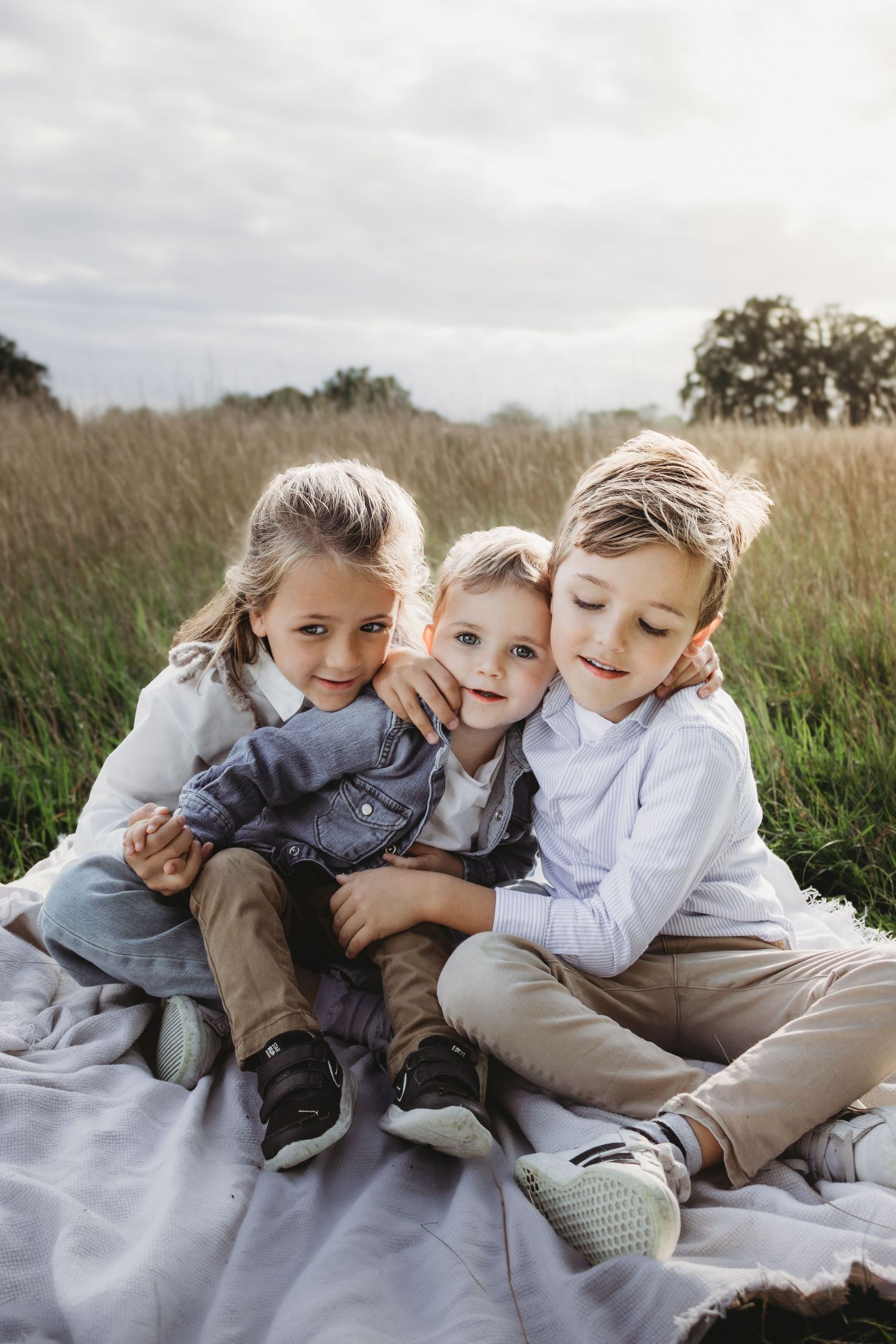 Family photography session in Surrey countryside – joyful candid family moment captured at sunset