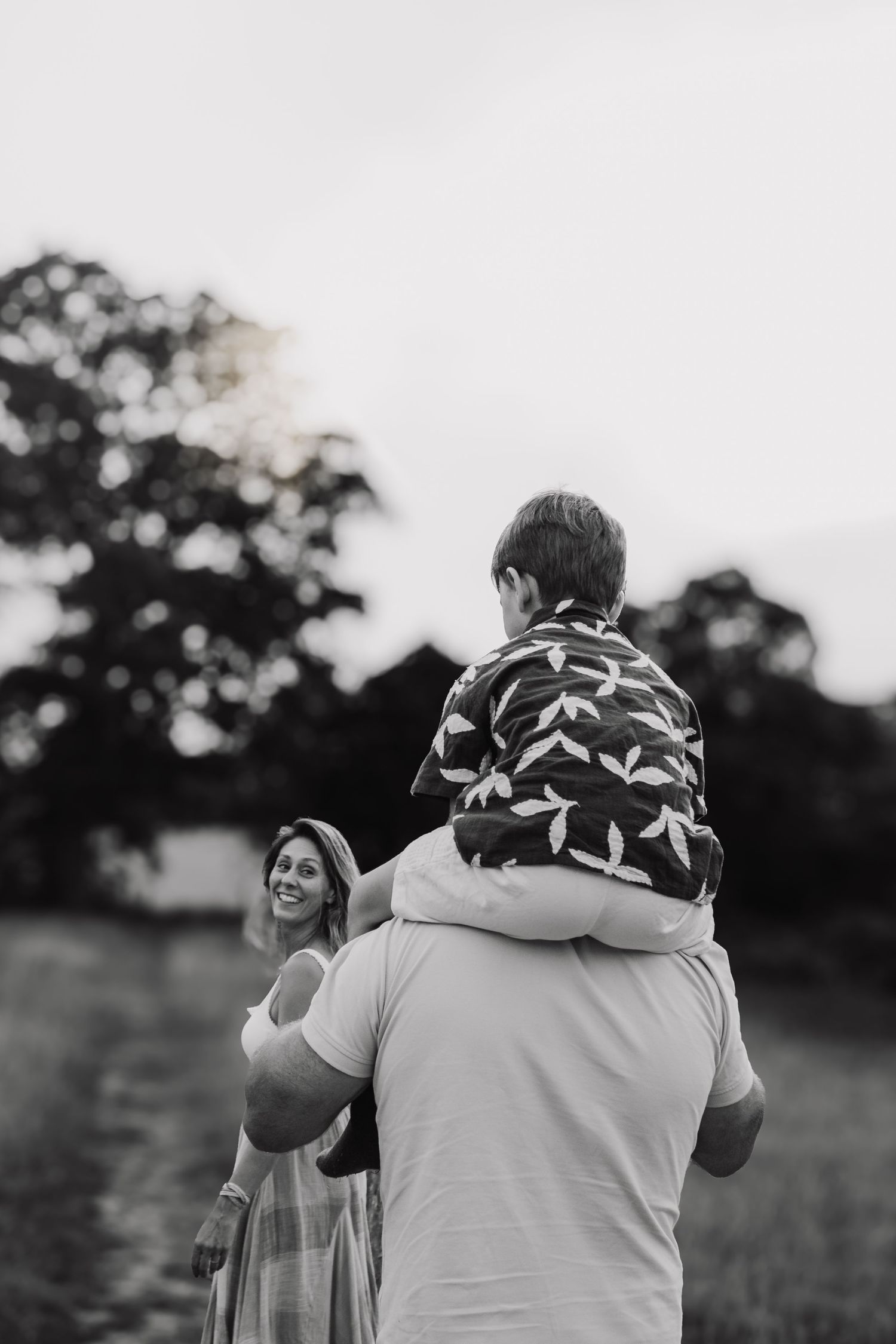 Family photography session in Surrey countryside – joyful candid family moment captured at sunset
