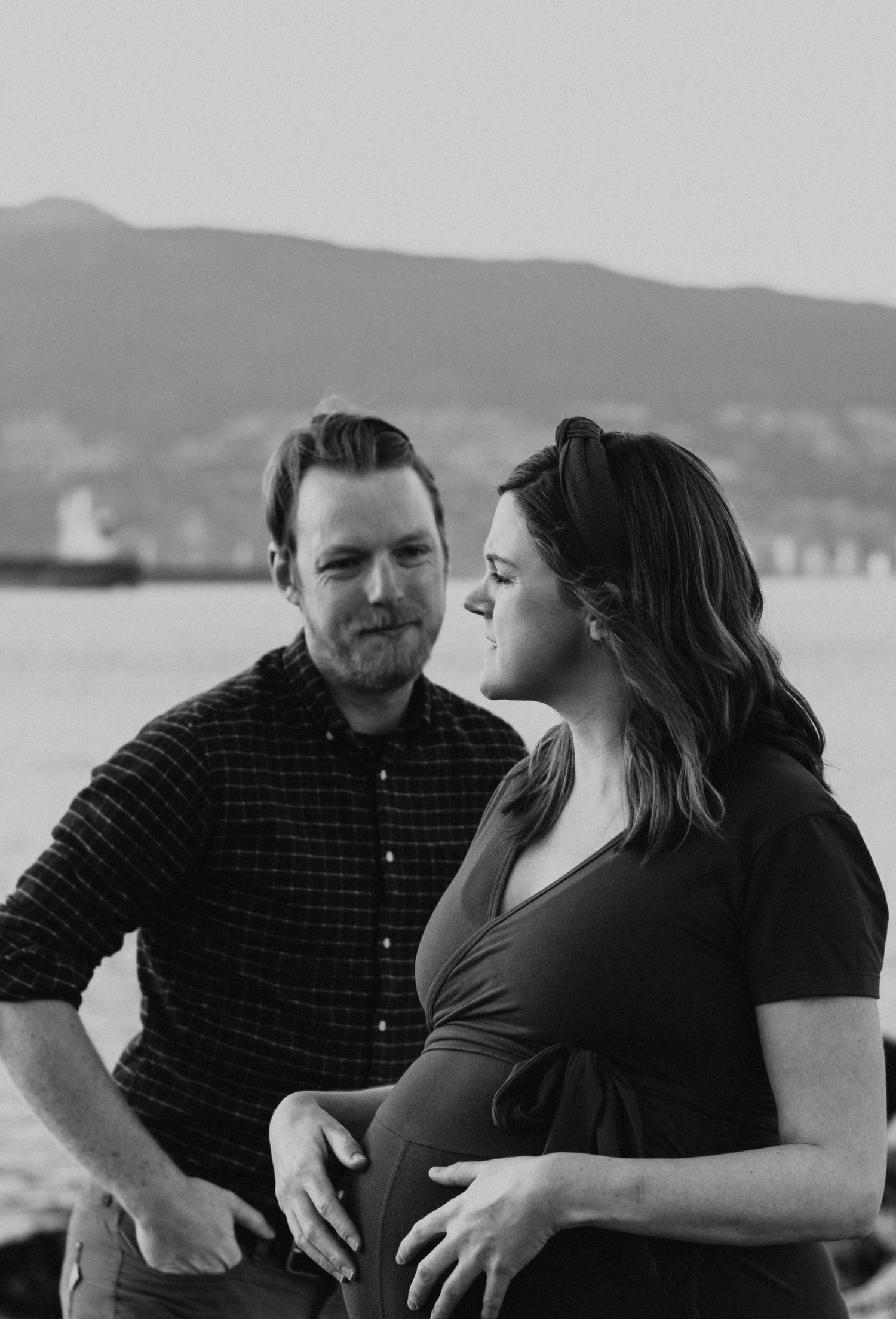 Tender maternity moment captured during family photography session in Vancouver Jericho Beach