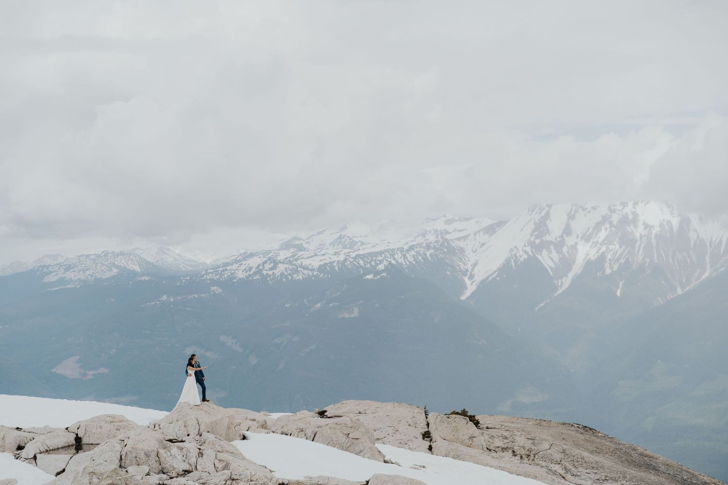 Documentary style wedding moment between bride and groom in Whistler