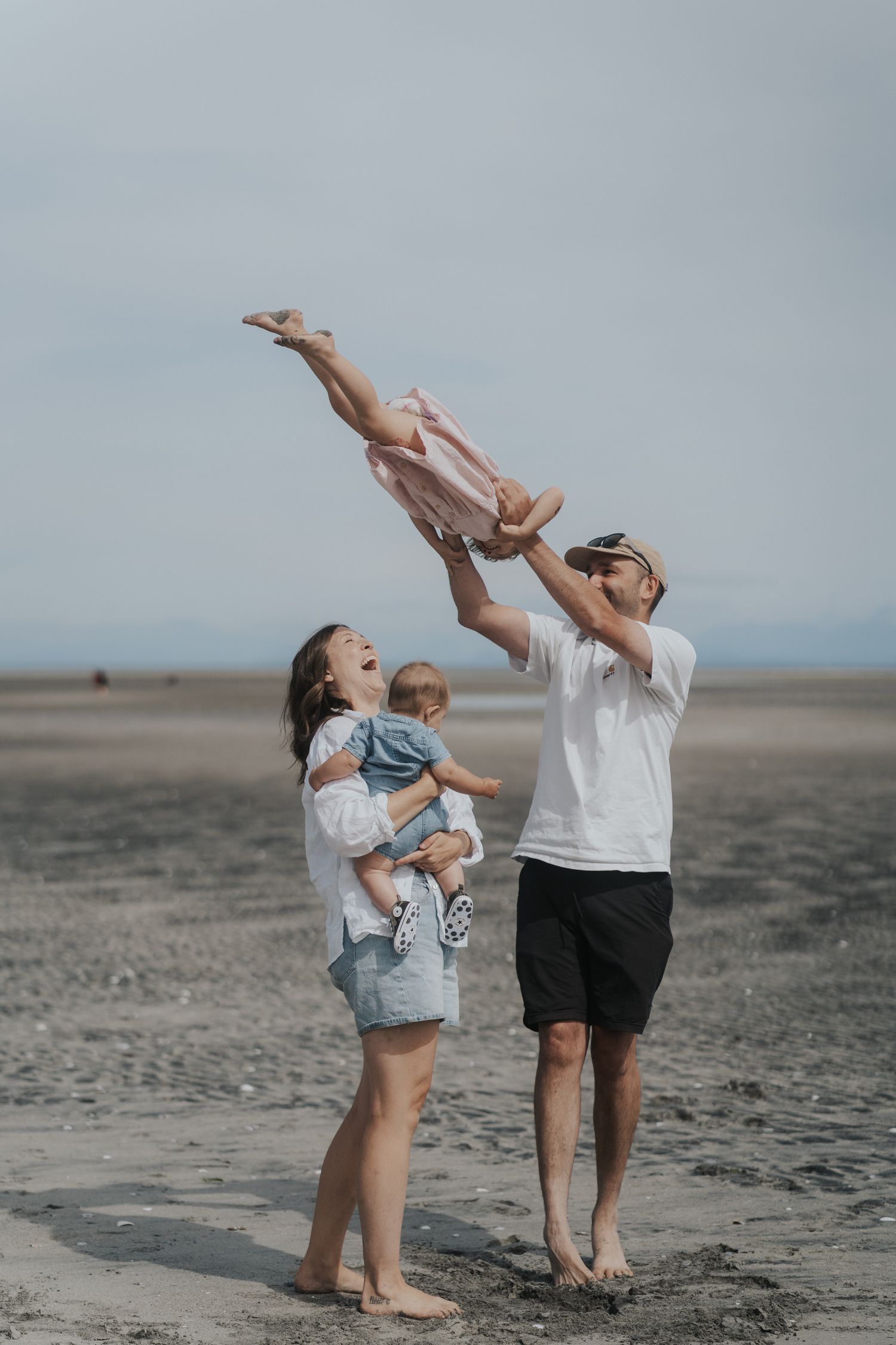 Mother holding baby during outdoor lifestyle photography session in Vancouver