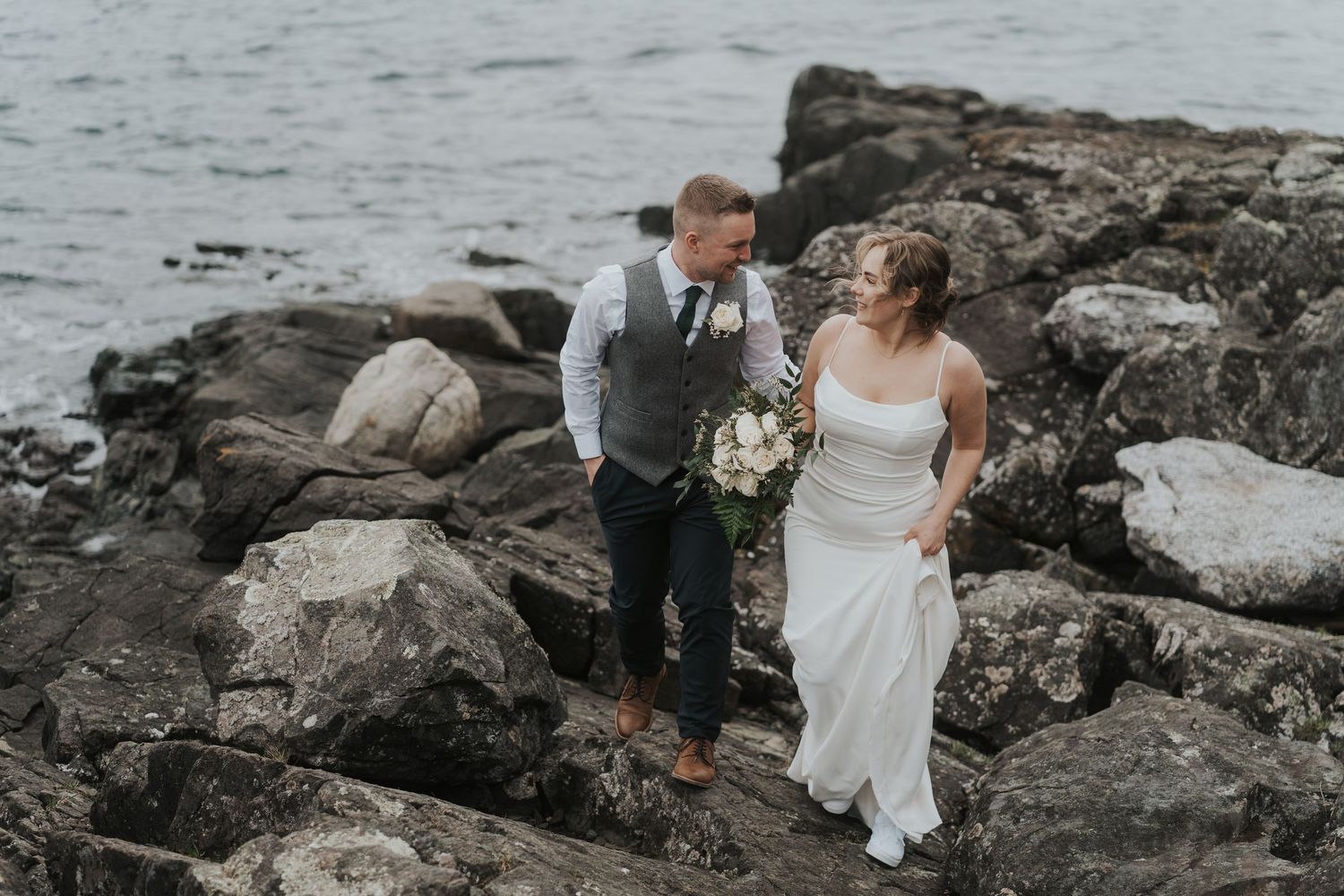 Documentary style wedding moment between bride and groom in Browns Bay resort vancouver island