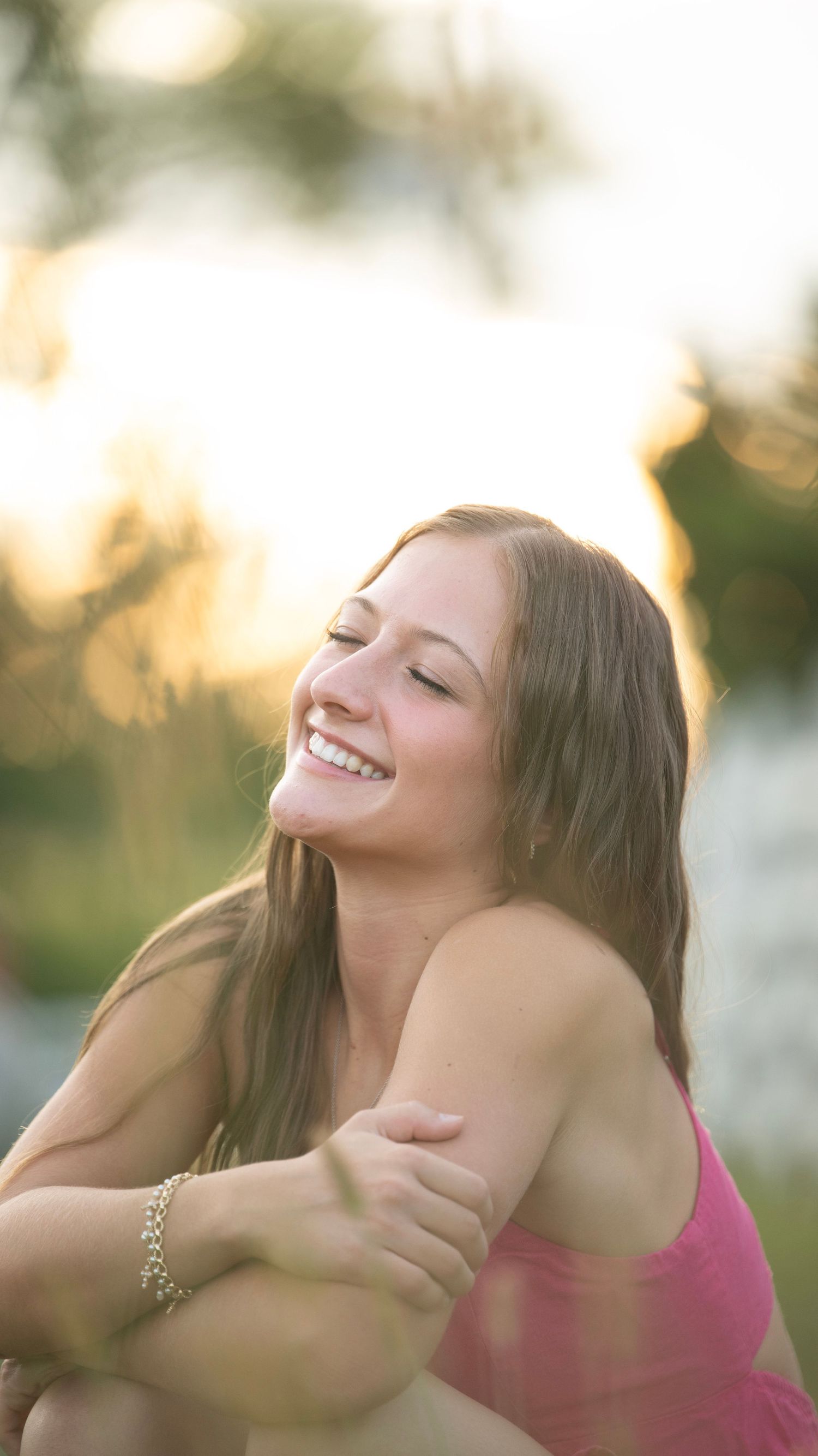Dreamy outdoor portrait with gentle expressions in evening light.