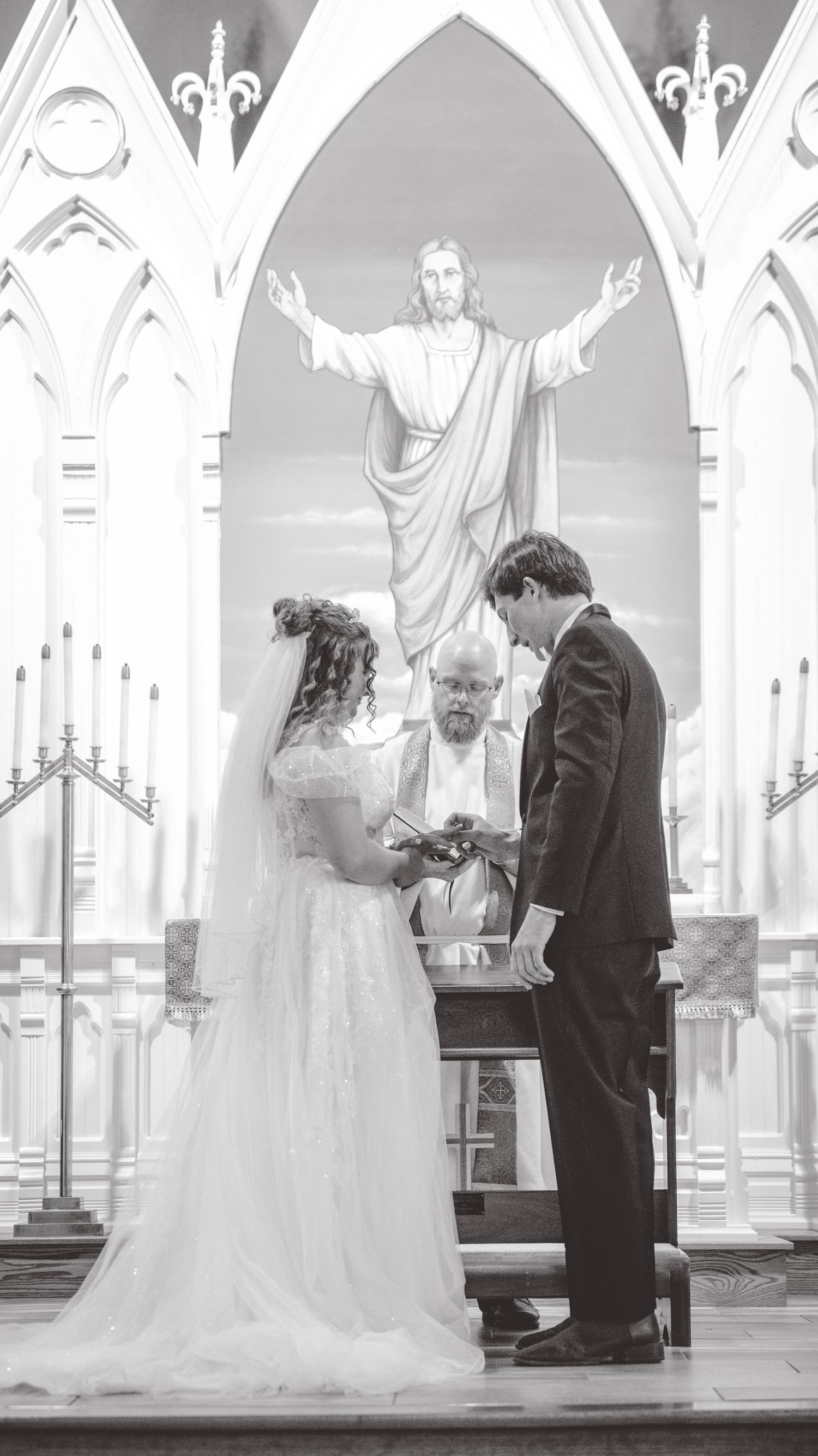 Black and white photos of a wedding ceremony under ornate gothic church arches.