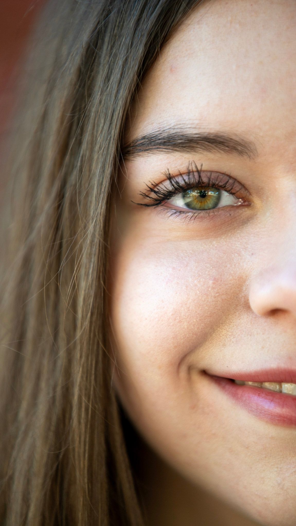 Close-up sequence showing details of eyes, smile and facial features.