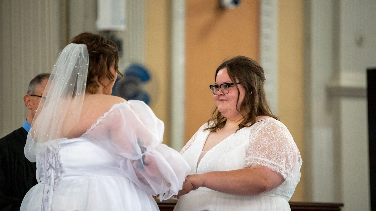 Wedding celebration candid moments in an elegant church sanctuary.