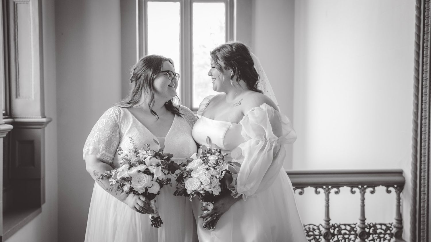 Black and white panoramic series of wedding moments captured in a bright interior space.
