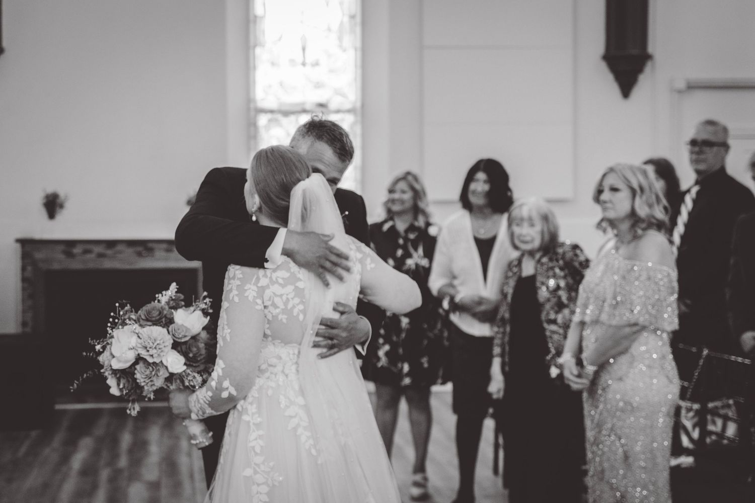 Black and white photo of wedding ceremony moments in a church setting.