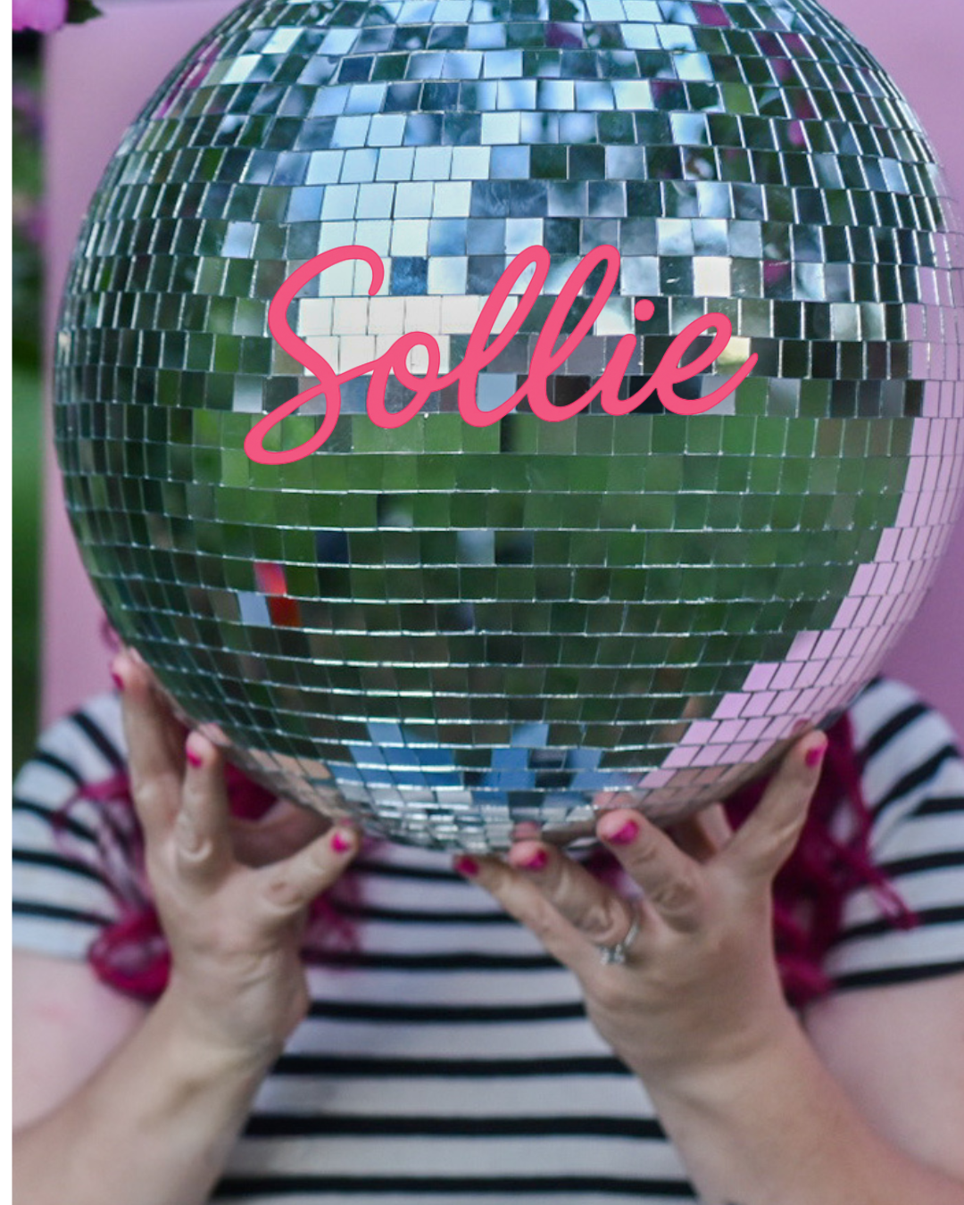 A silver disco ball with the word 'Sollie' held by hands against a purple background.