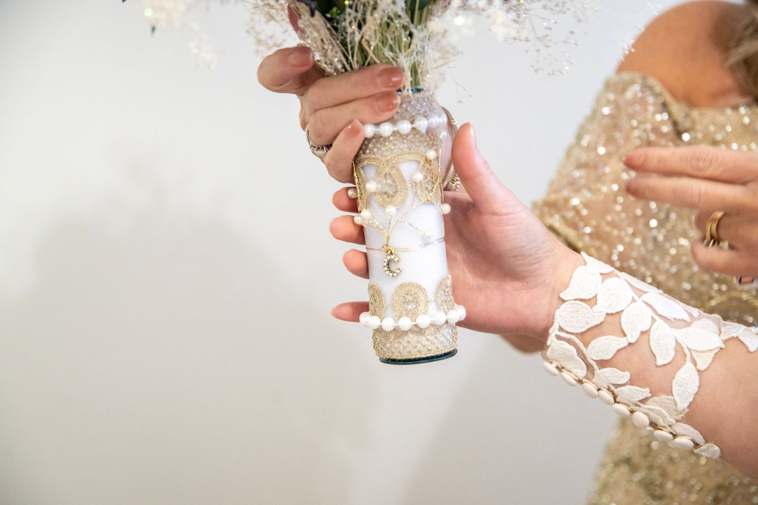 Close-up details of sparkly bridesmaid dresses and wedding preparations.