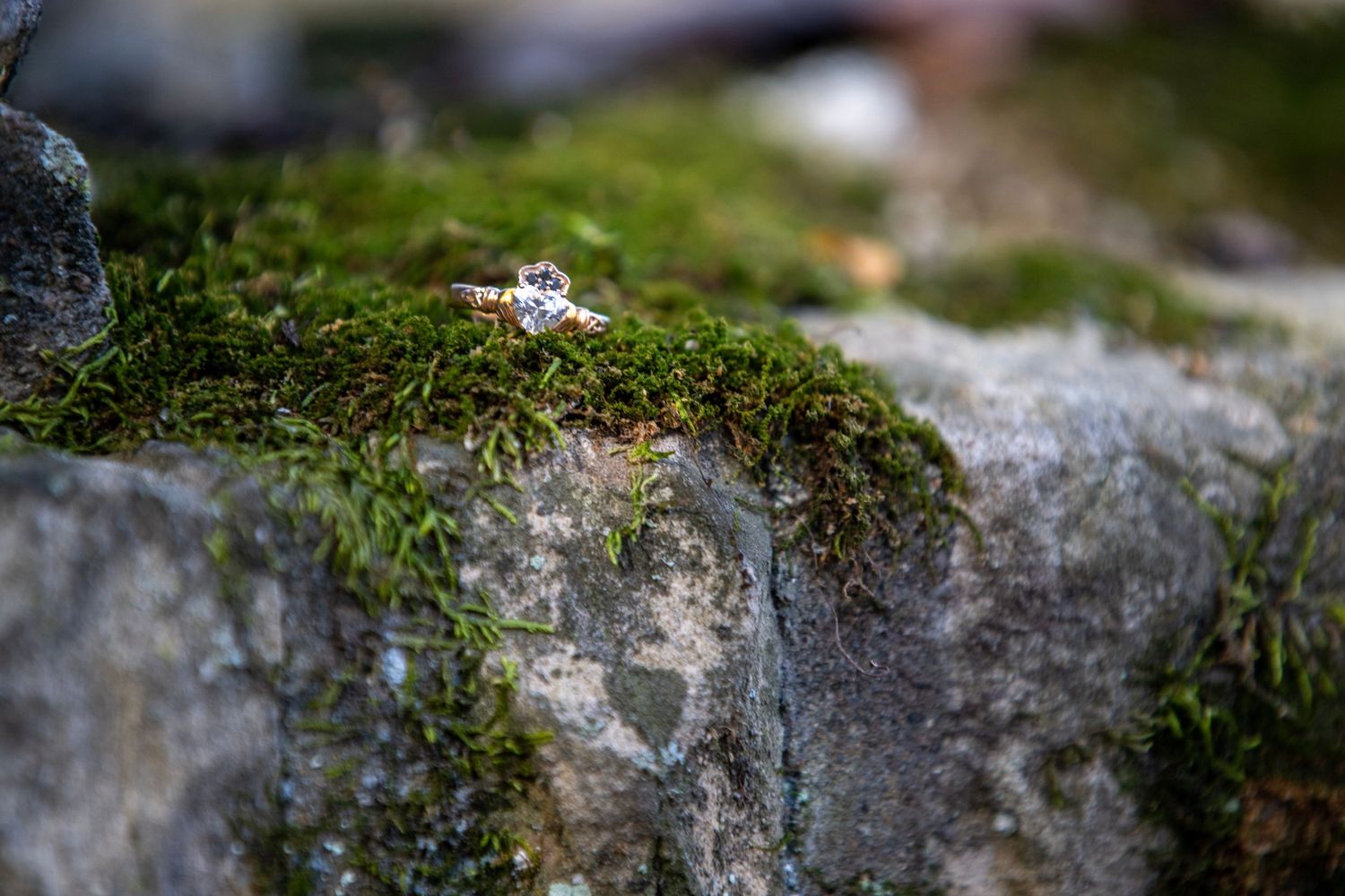 Close-up of moss-covered stone architecture in natural lighting.