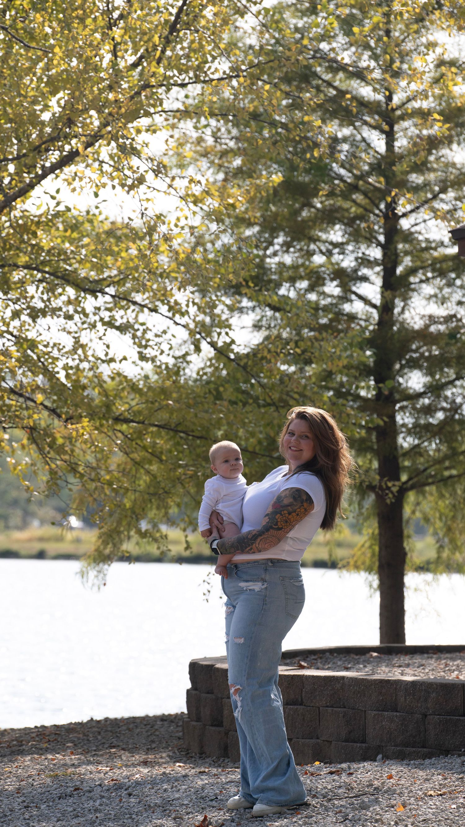 Series of tender family moments captured by the lake during golden hour.