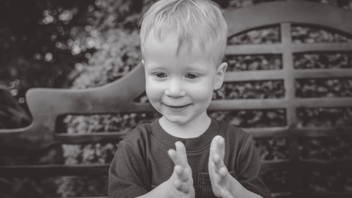 Collection of black and white portraits showing expressions while seated on a bench.