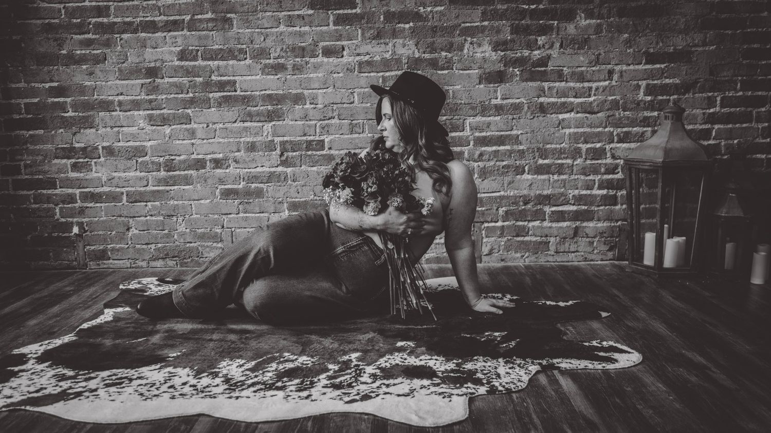 Artistic black and white photograph of brick wall texture with vintage lighting.