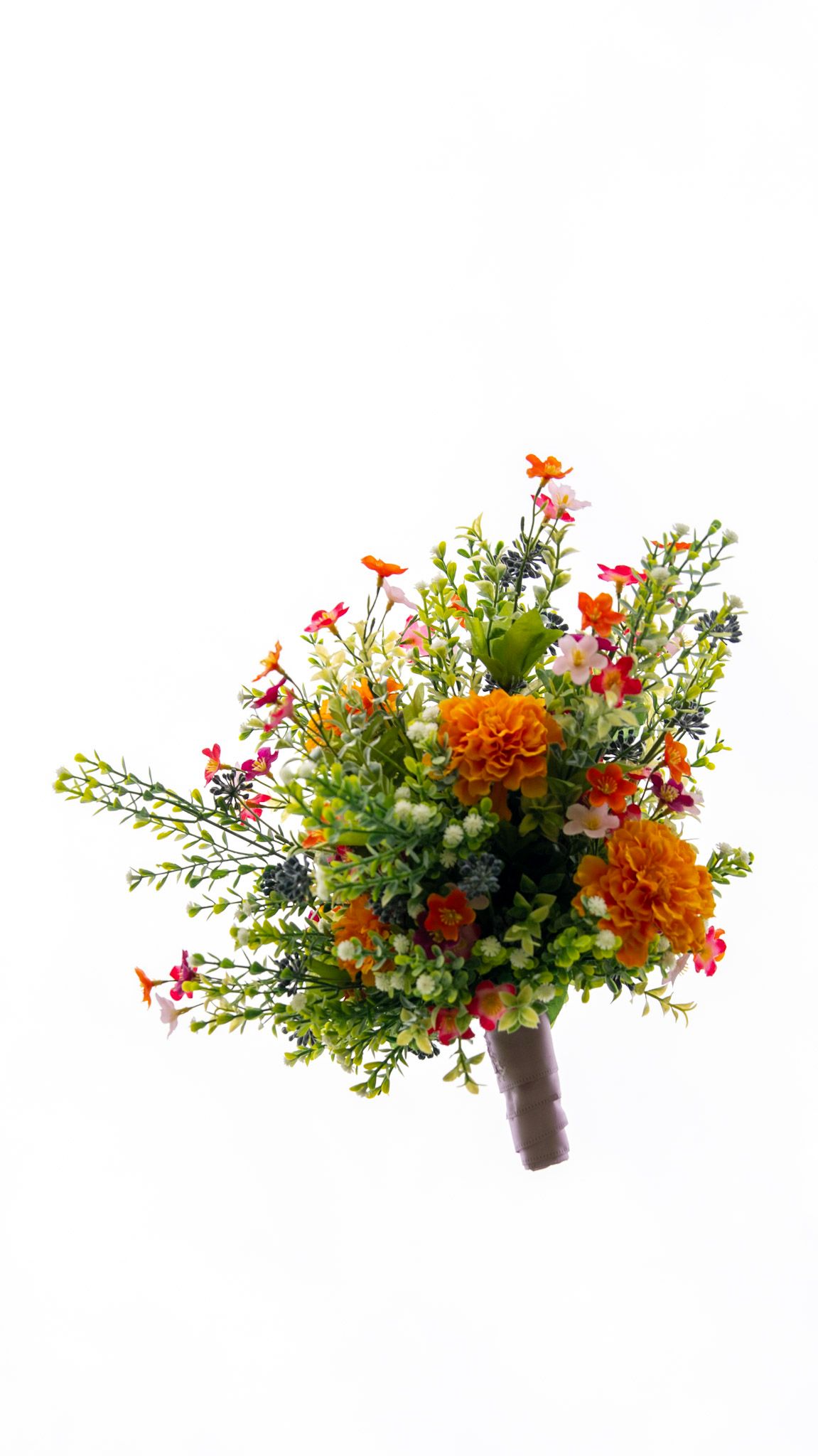 Colorful wedding bouquet with orange marigolds and greenery against white background.