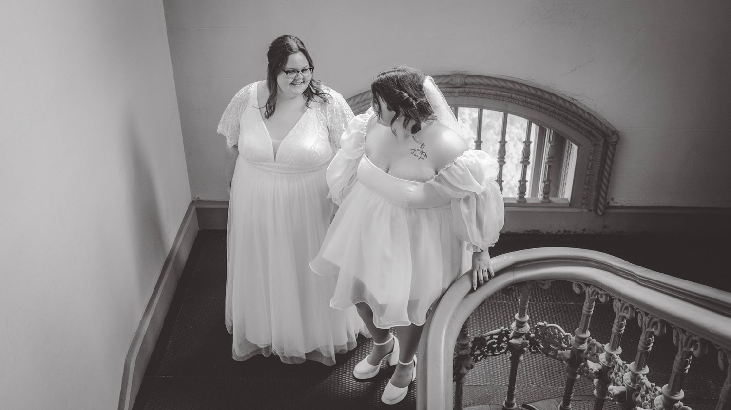 Black and white wedding photography series showing couples on a historic staircase.