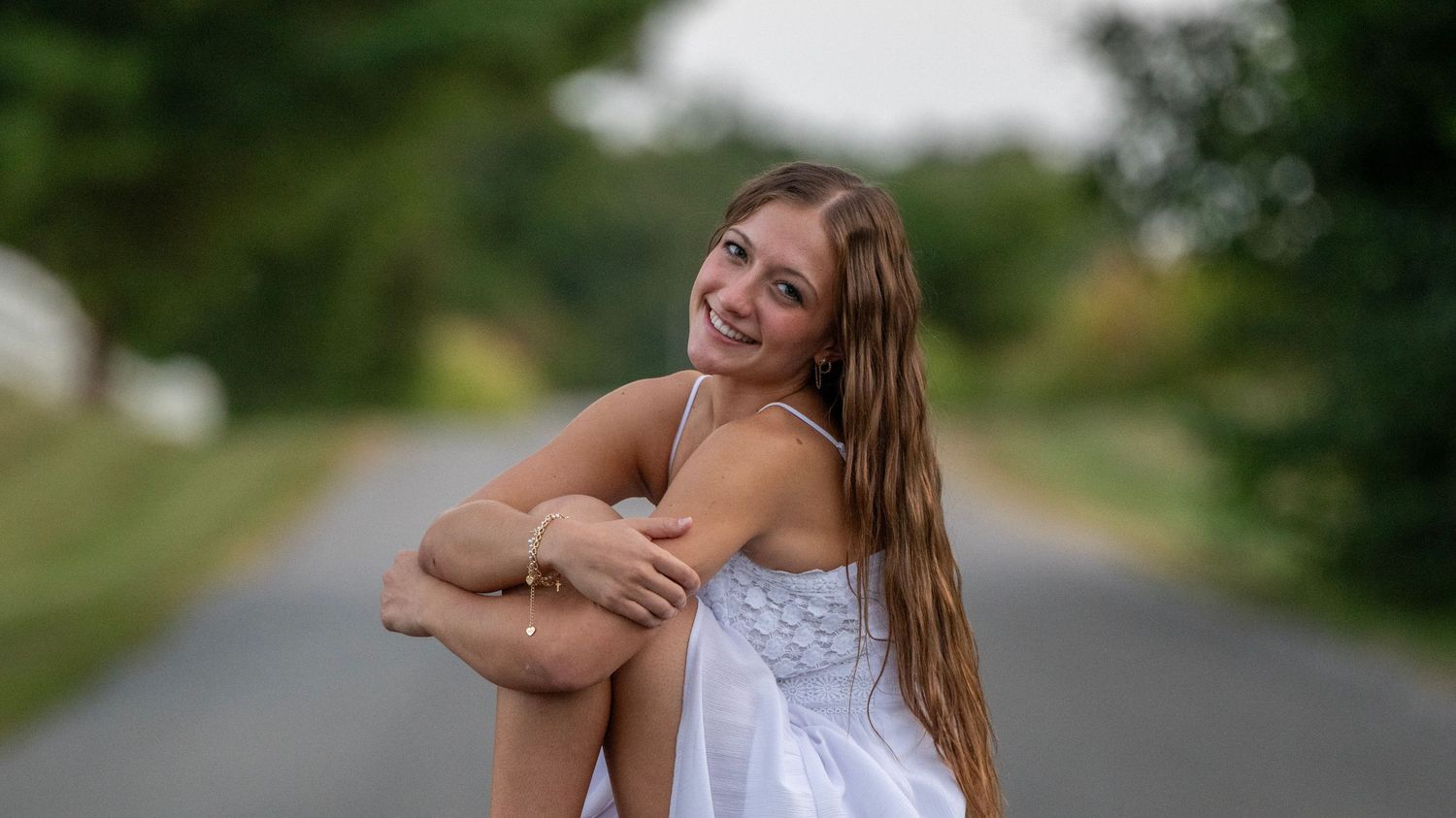 Joyful outdoor portrait session with expressive poses and natural lighting.