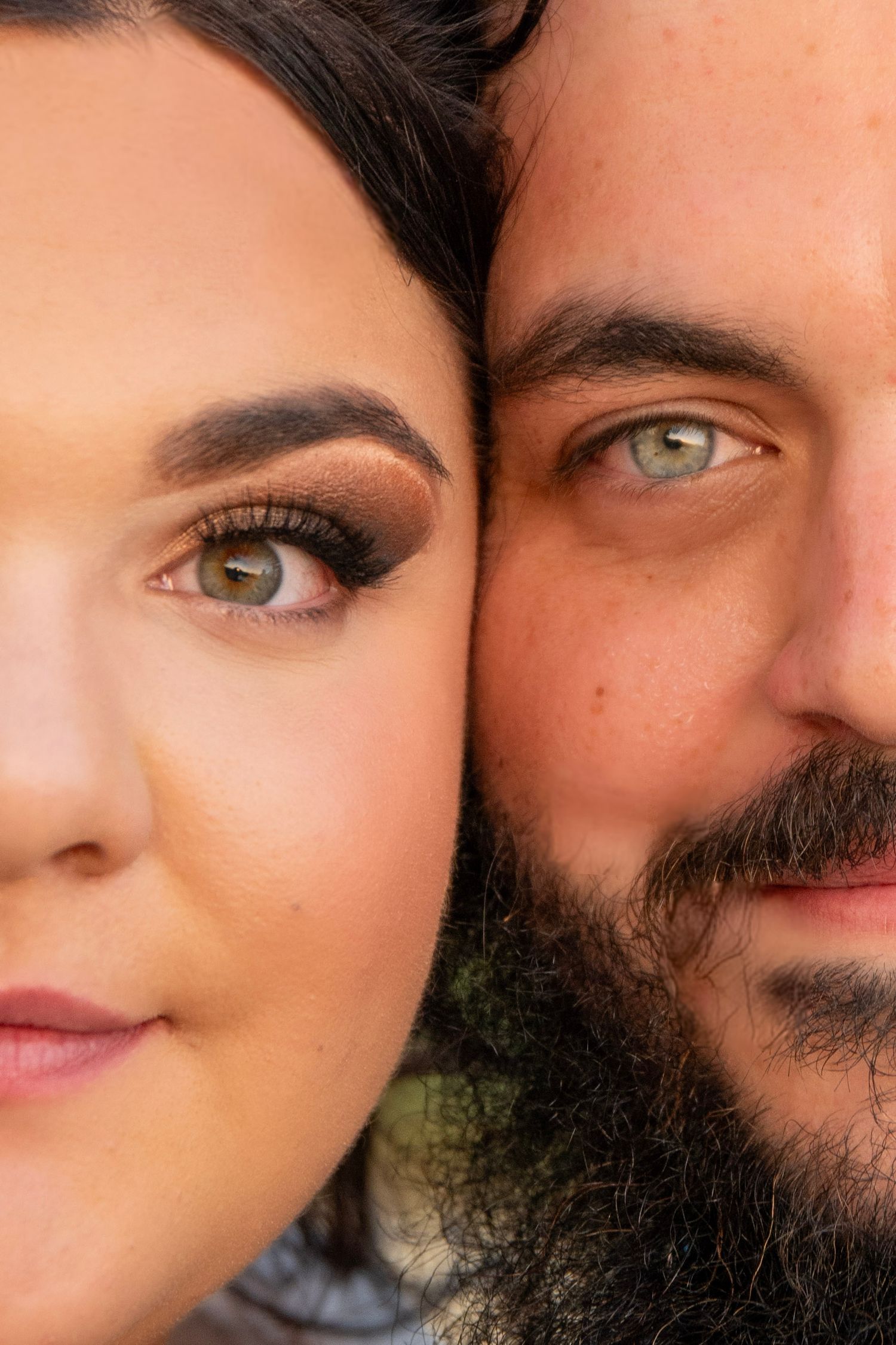 Extreme close-up portrait showing two pairs of eyes and partial faces.