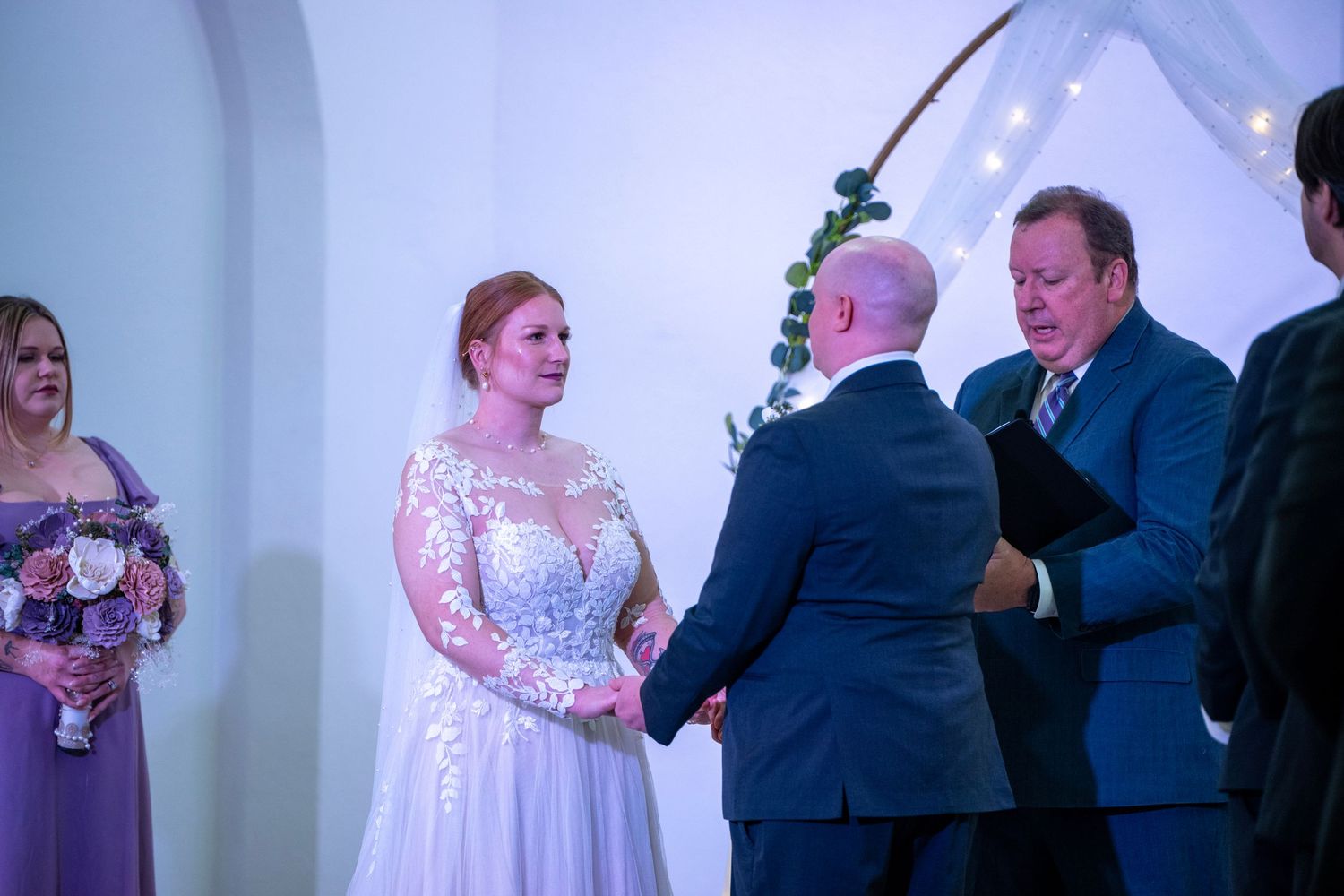Wedding ceremony participants during emotional moments in church setting.