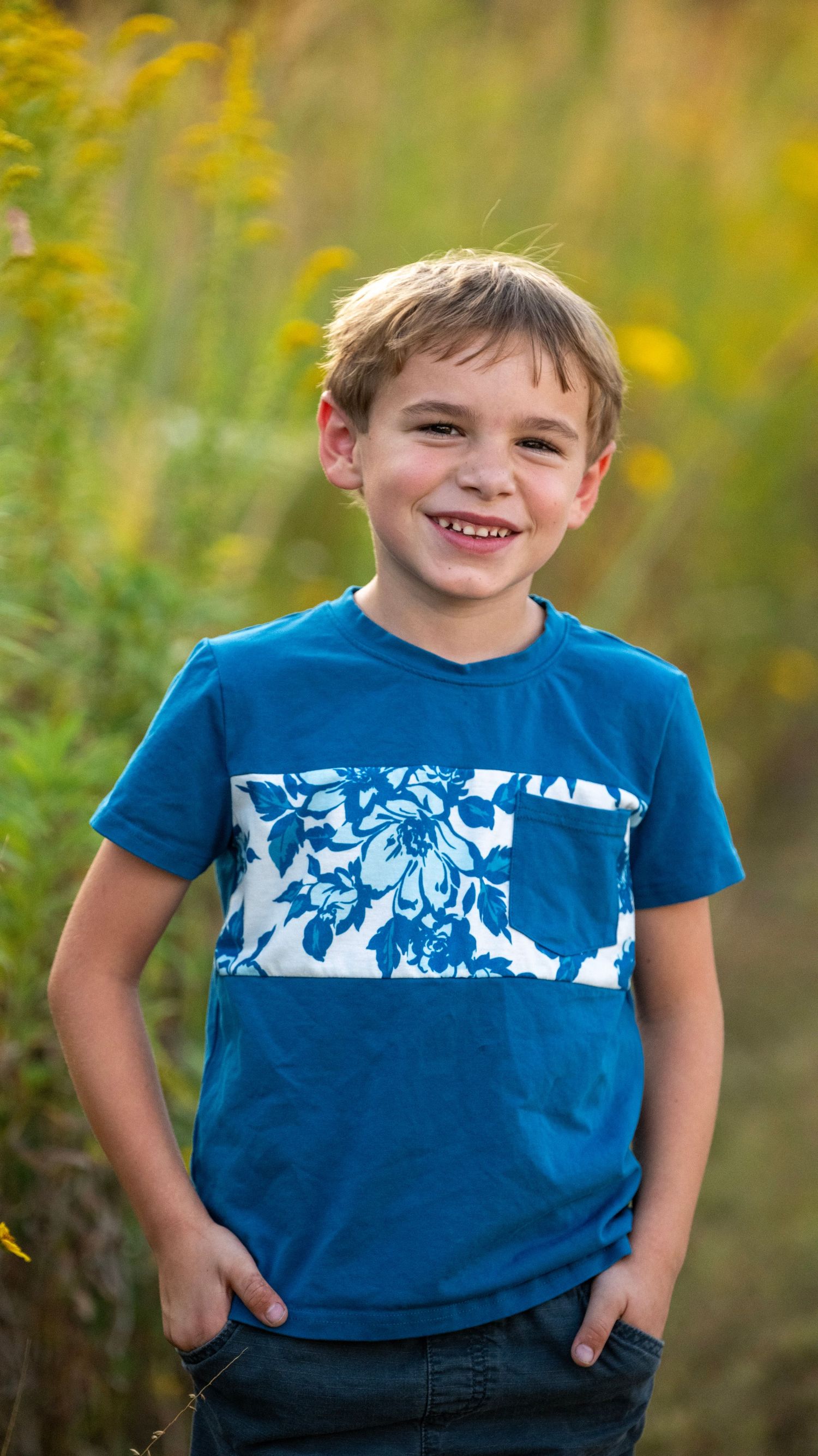 Series of shots showing a blue t-shirt with white pattern detail against yellow wildflowers.
