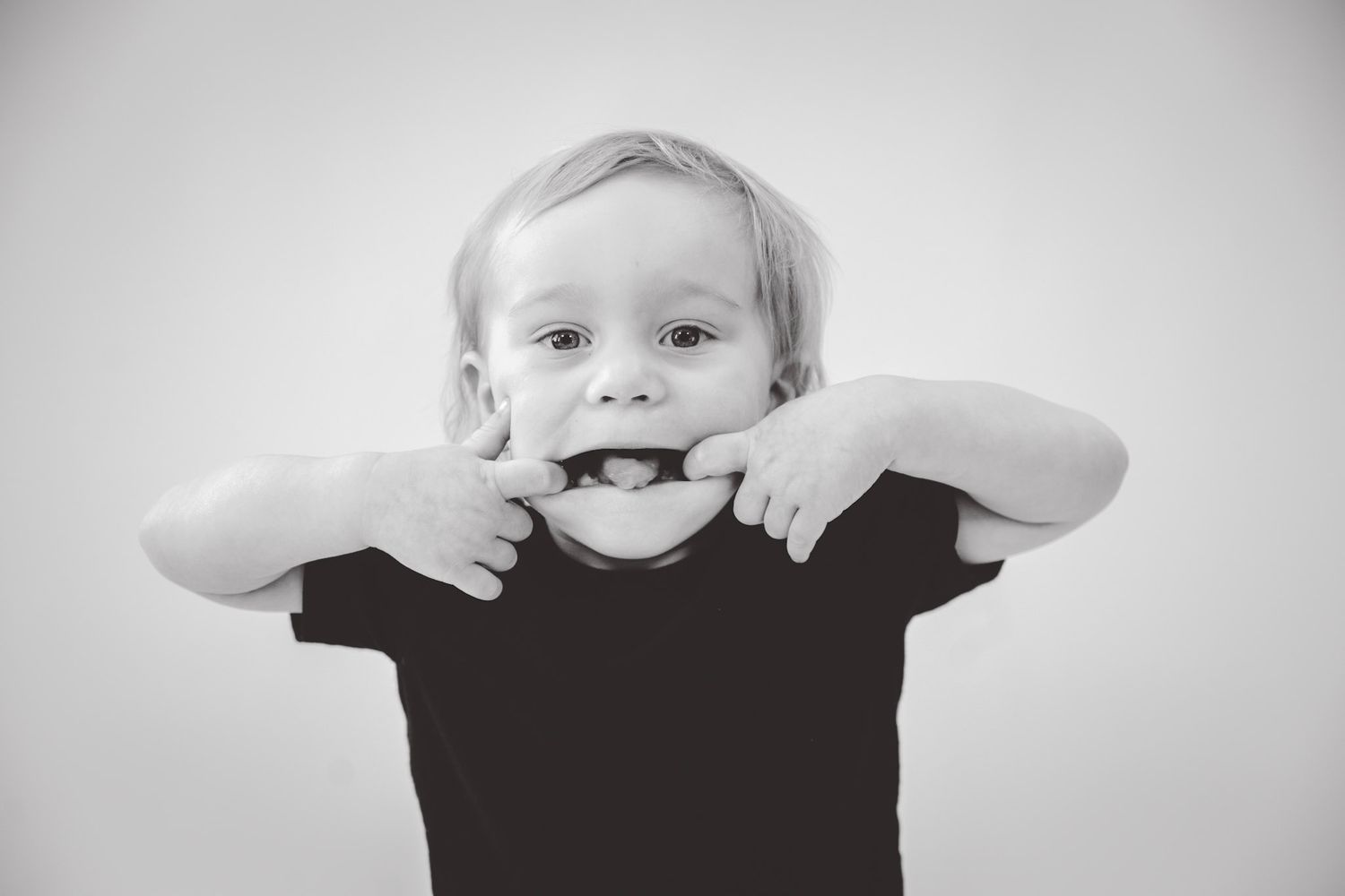Black and white close-up series of playful expressions.