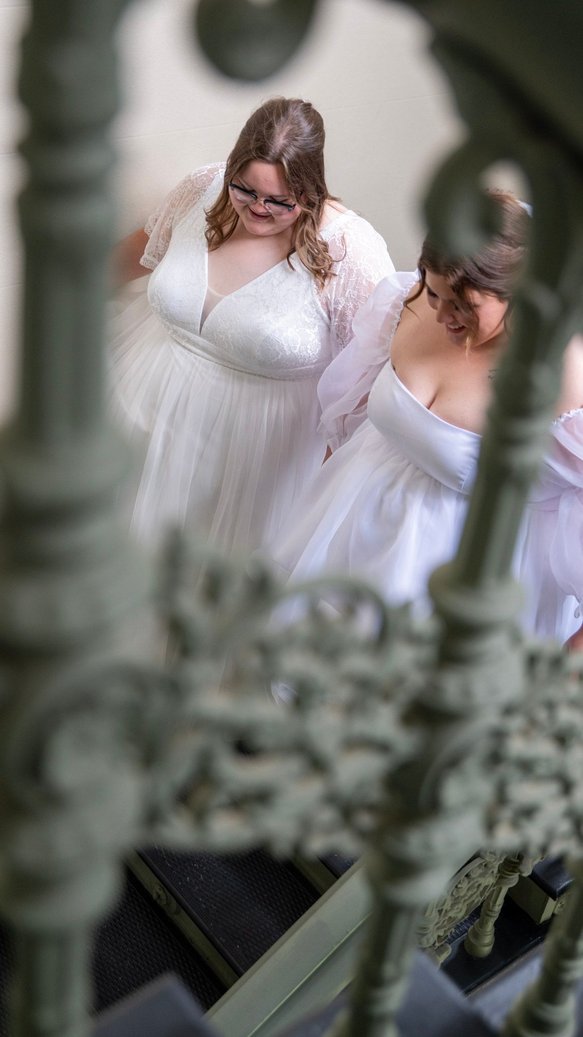 Artistic wedding photography series with soft focus and architectural elements in the foreground.