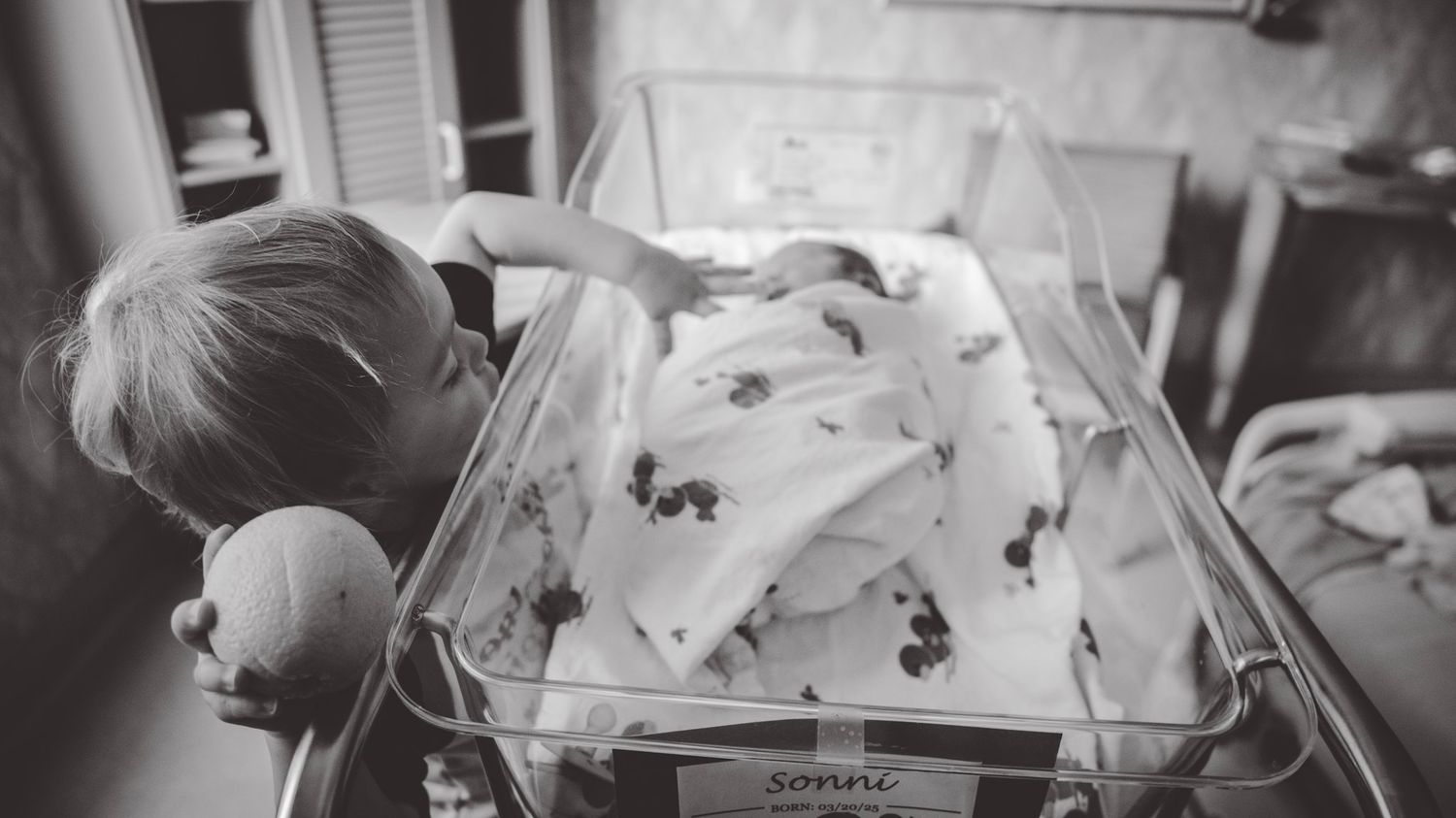 Black and white panoramic series of tender hospital moments.