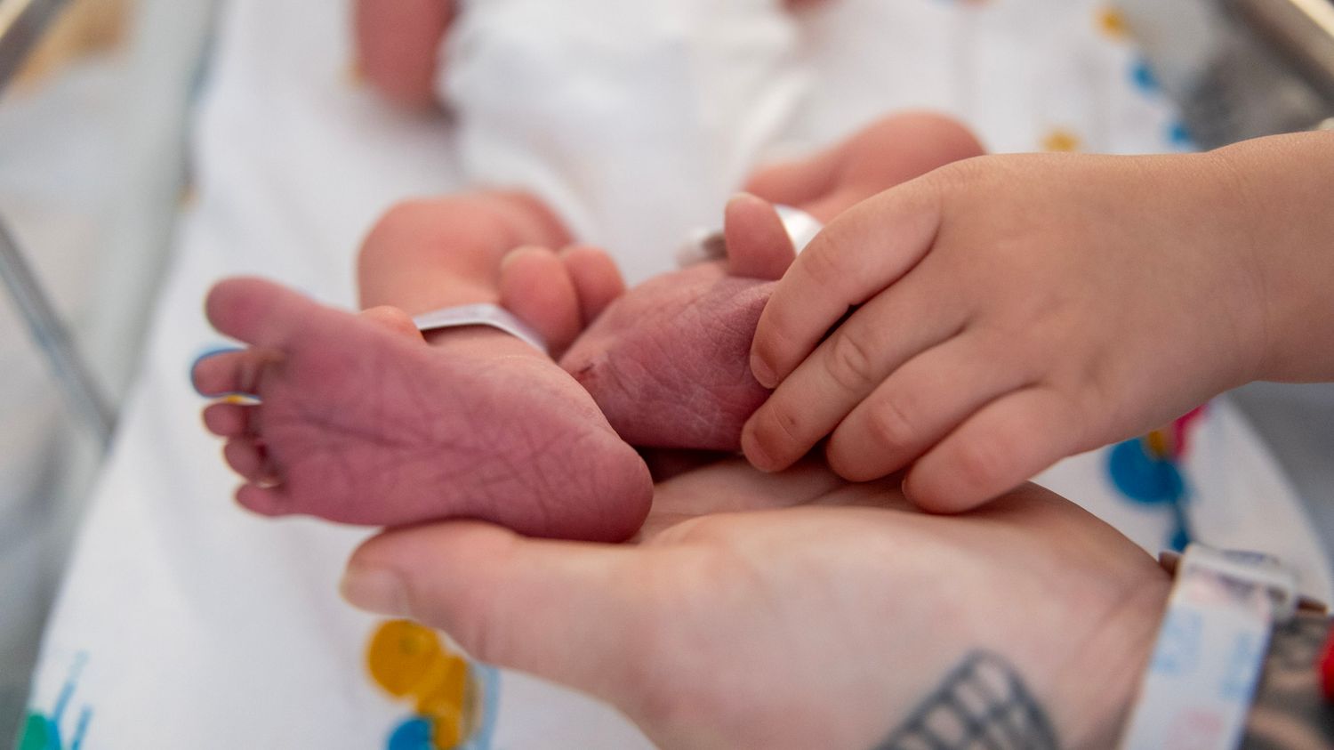 Close-up shots of tiny newborn fingers and hands in the hospital.
