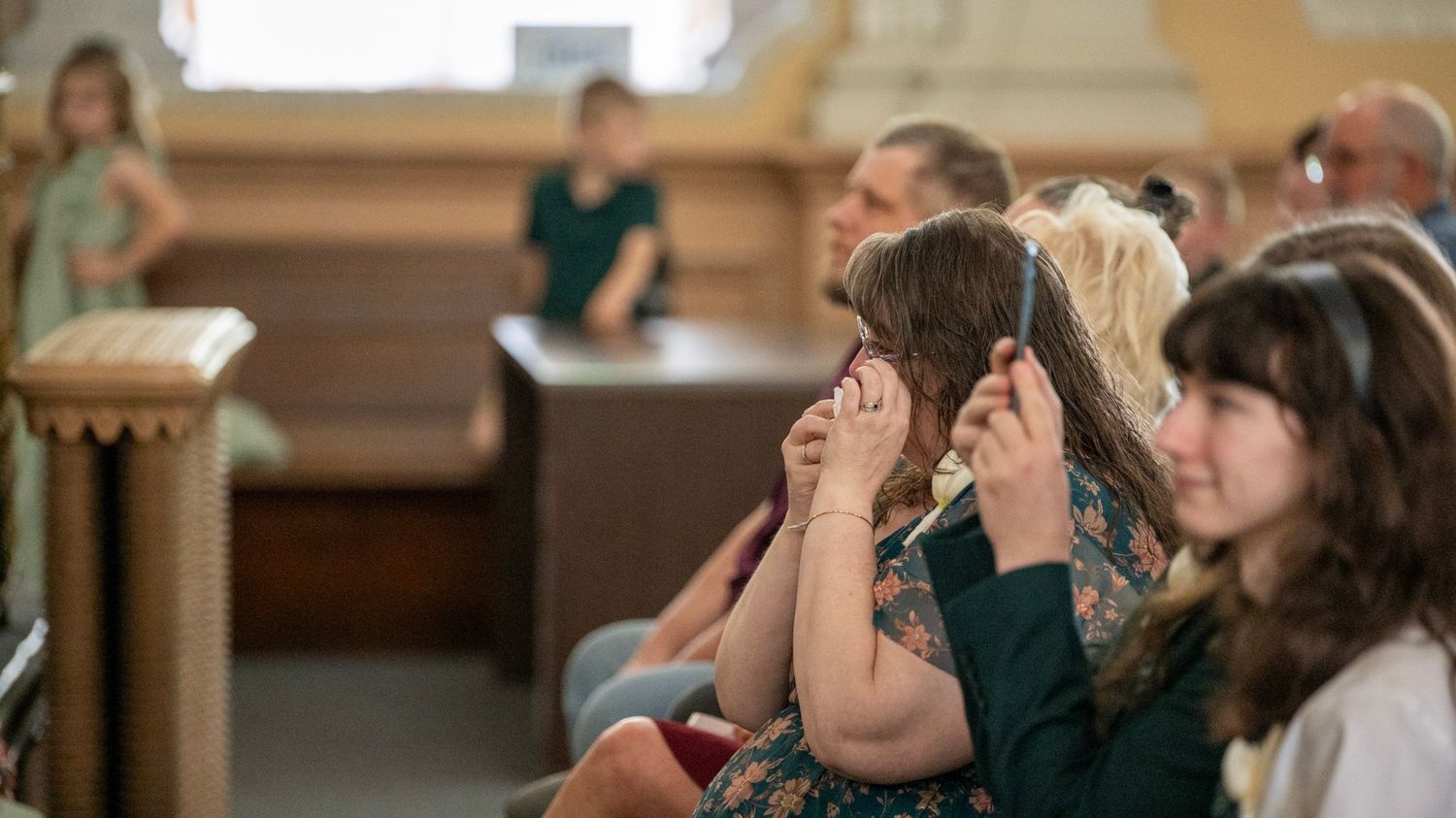 Emotional wedding ceremony moments captured in a beautiful church setting.