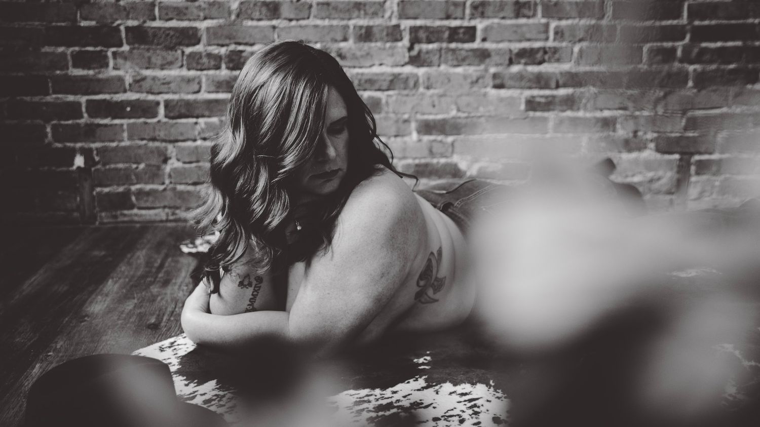 Artistic sequence with soft focus effects showing figure against brick wall backdrop.