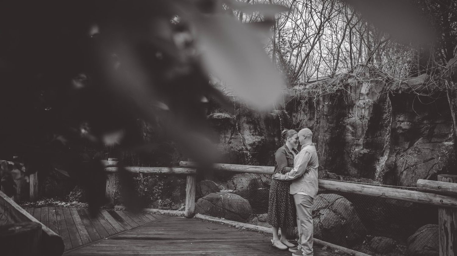 A romantic photoshoot sequence captured in dramatic black and white tones.