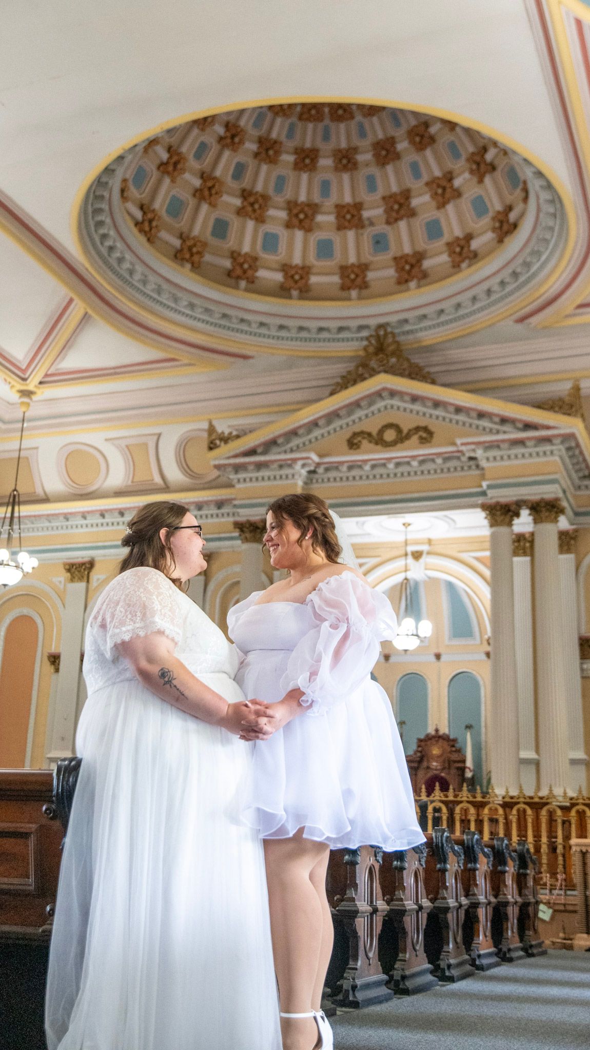 A romantic wedding photo series showing couples in white dresses against an ornate domed ceiling with classical architecture.