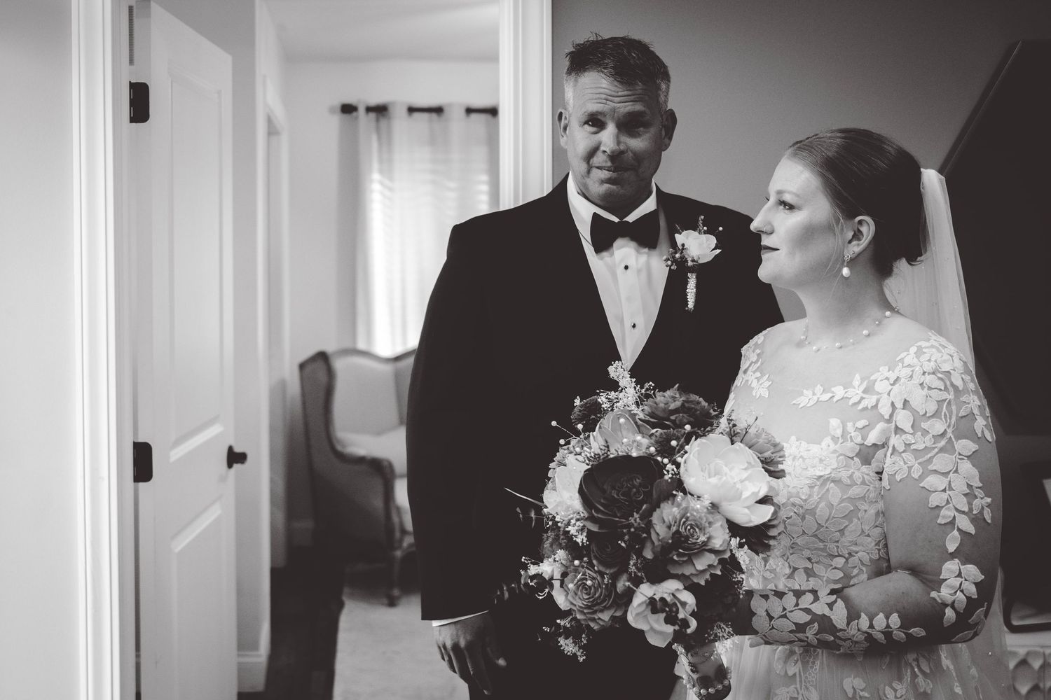 Black and white wedding photos showing intimate moments during ceremony.