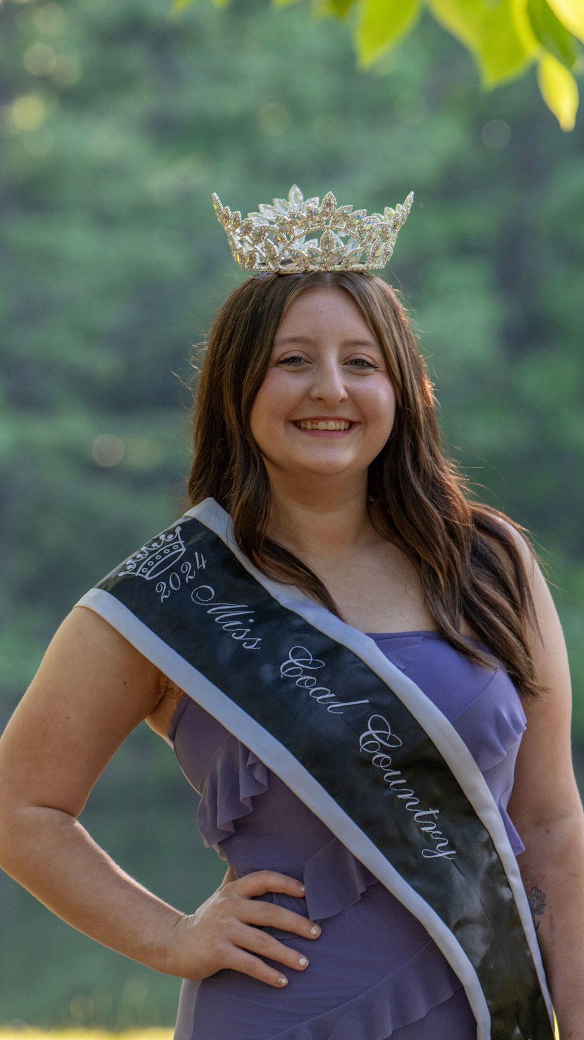 A contestant in purple dress wearing a crown and sash poses in multiple shots outdoors.