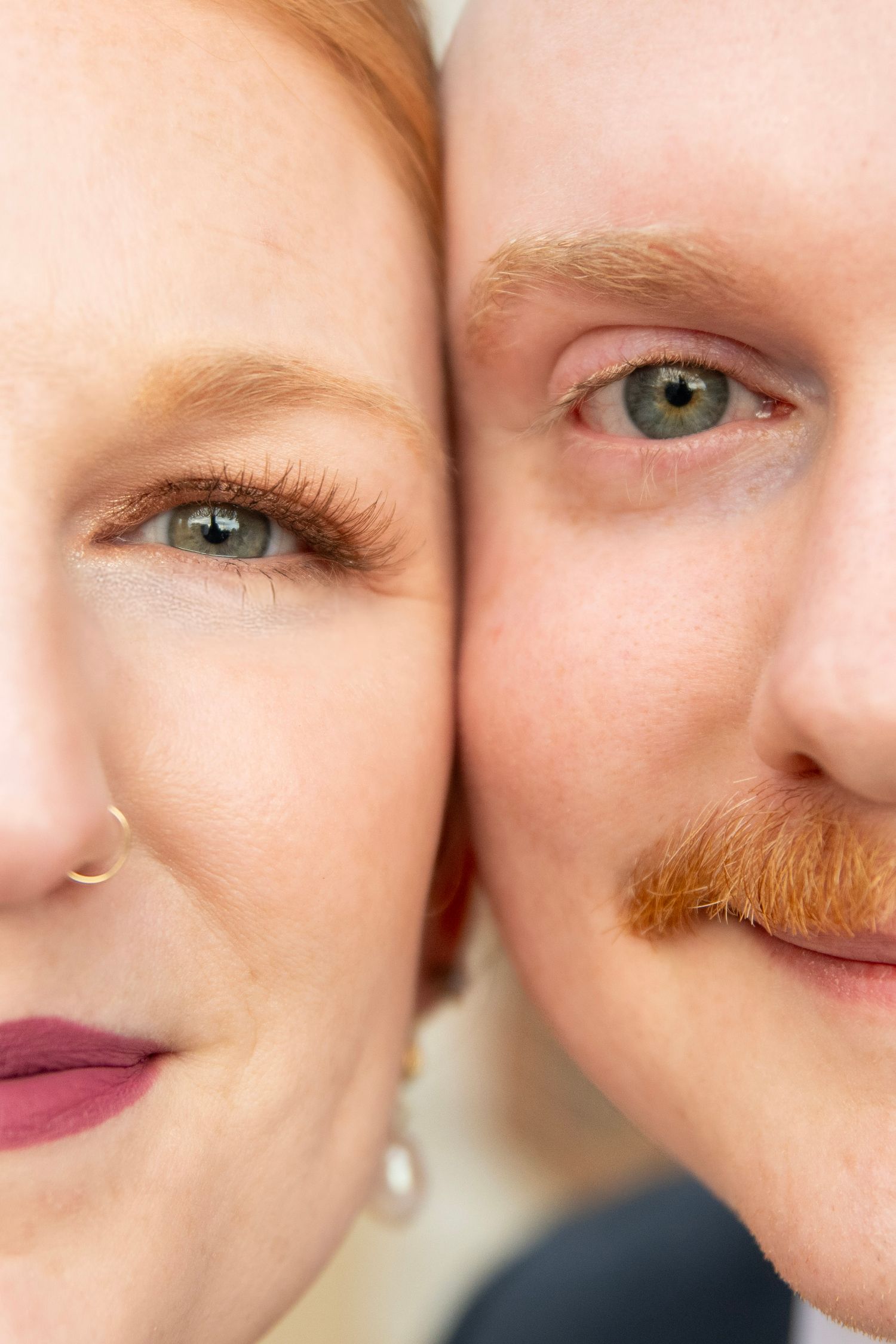Extreme close-up of eyes and facial features in soft natural lighting.