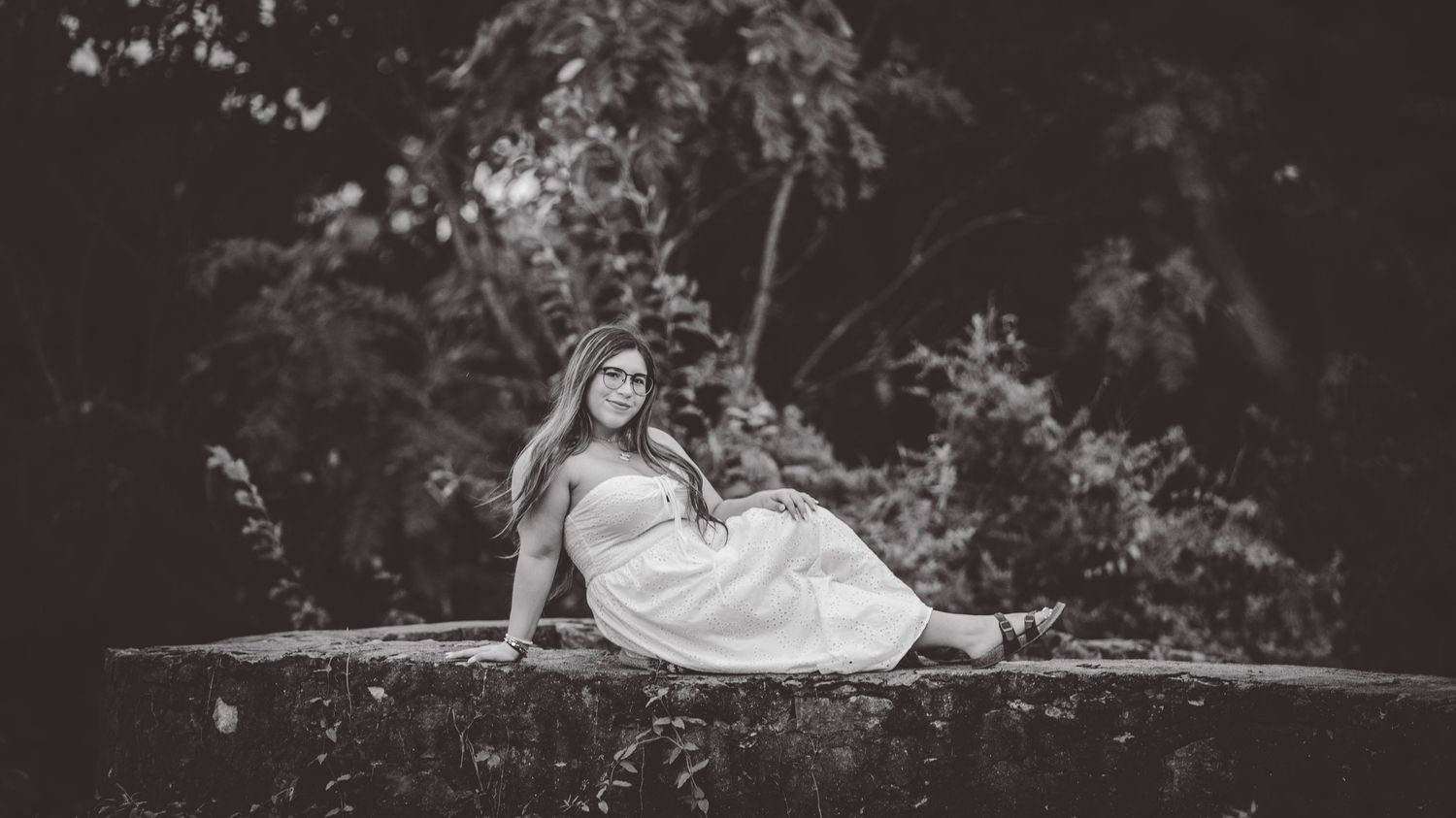Artistic black and white panoramic composition of outdoor portrait session.