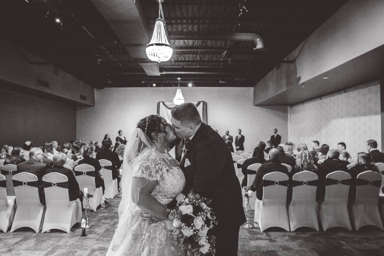 Black and white panorama sequence showing wedding reception venue with tables and chairs.