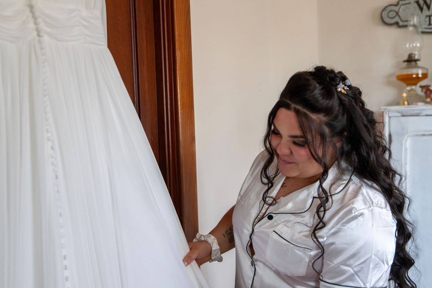 Close-up view of wedding dress details during final preparations.