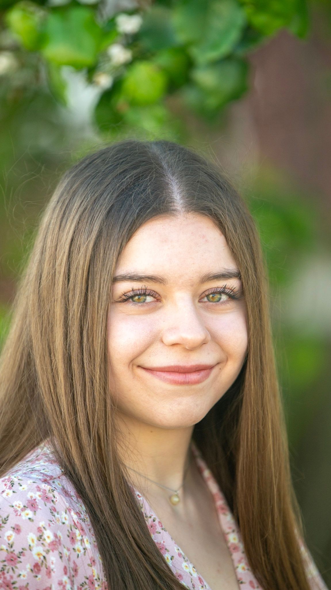 Close-up portrait series with soft natural lighting and green foliage background.