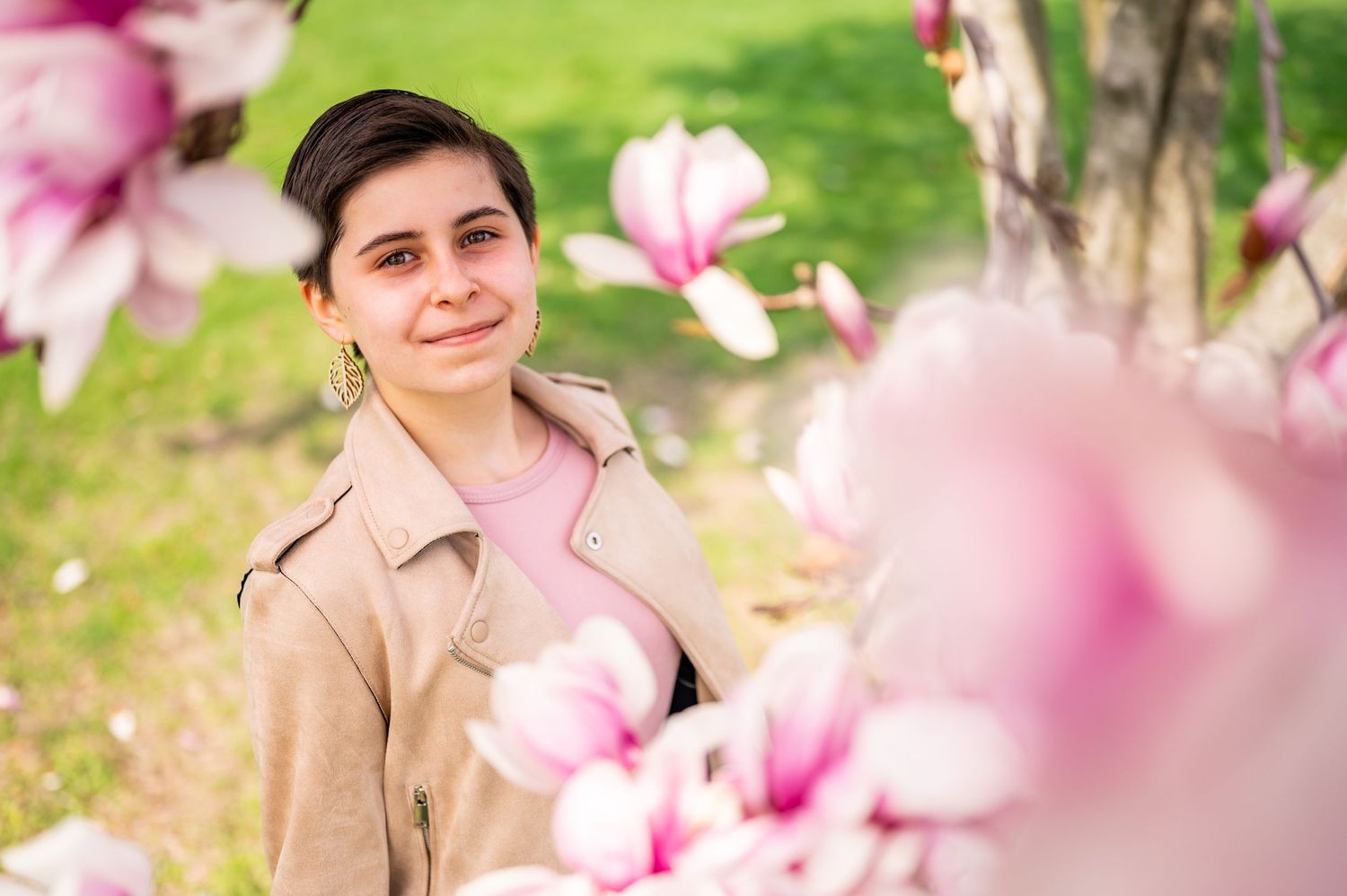 Close-up shots of pink magnolia blossoms with soft bokeh effect in natural lighting.